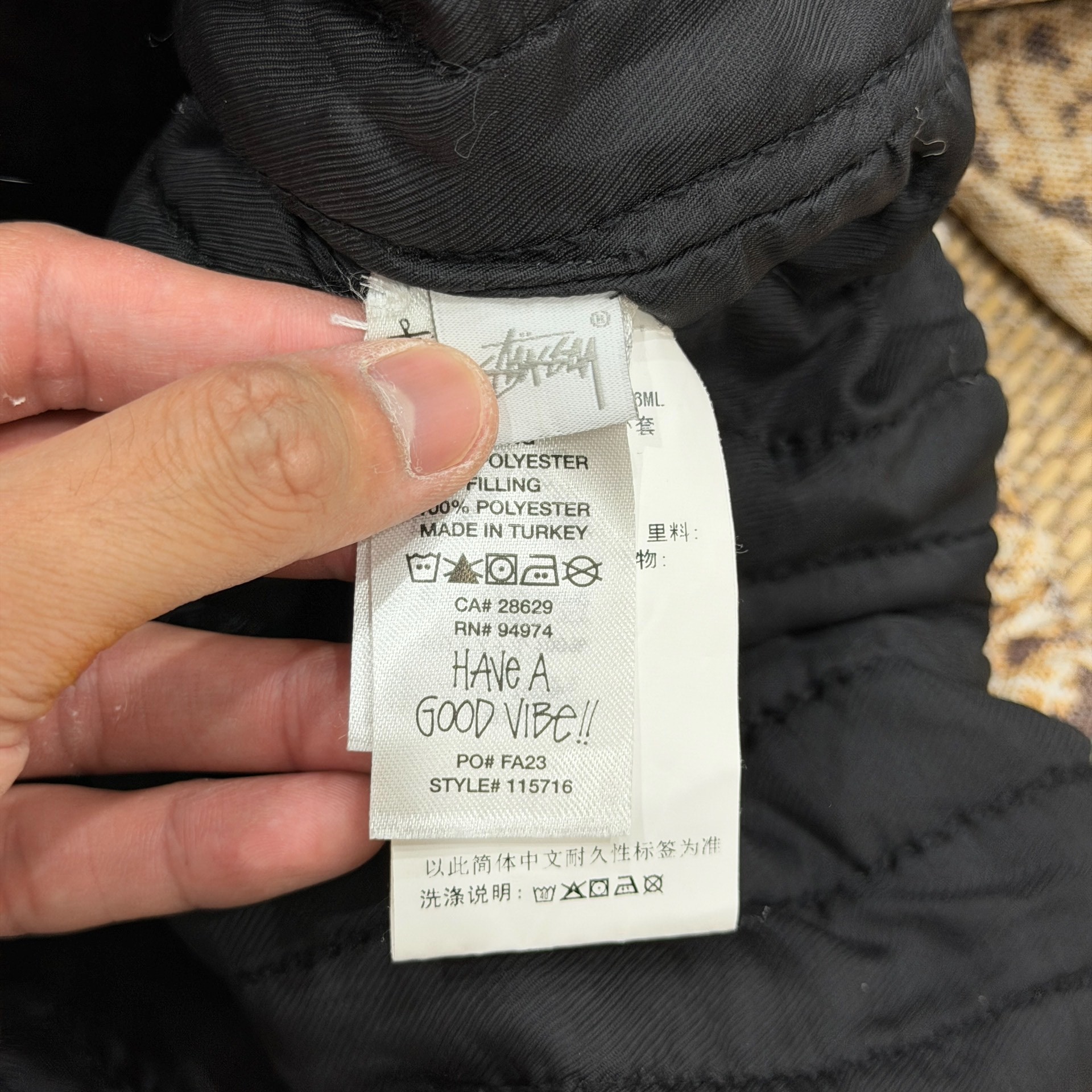 Stussy FW23 Snake Print Insulated Jacket — label