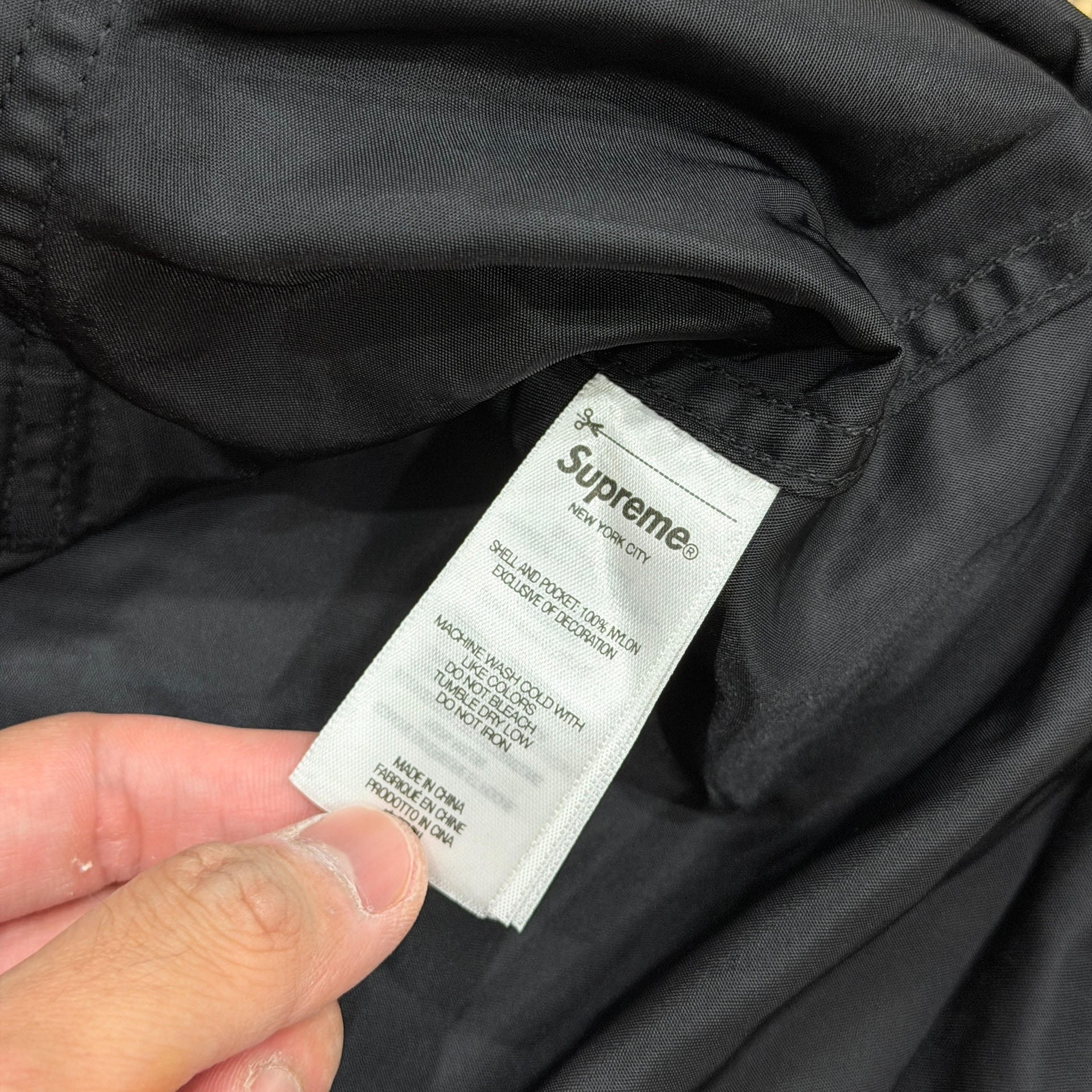 Supreme SS24 Nylon Chore Coat — label