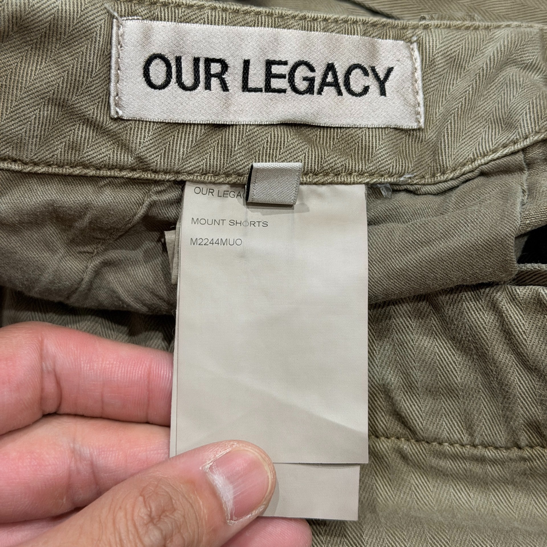 Our Legacy Faded Olive Cargo Shorts — label