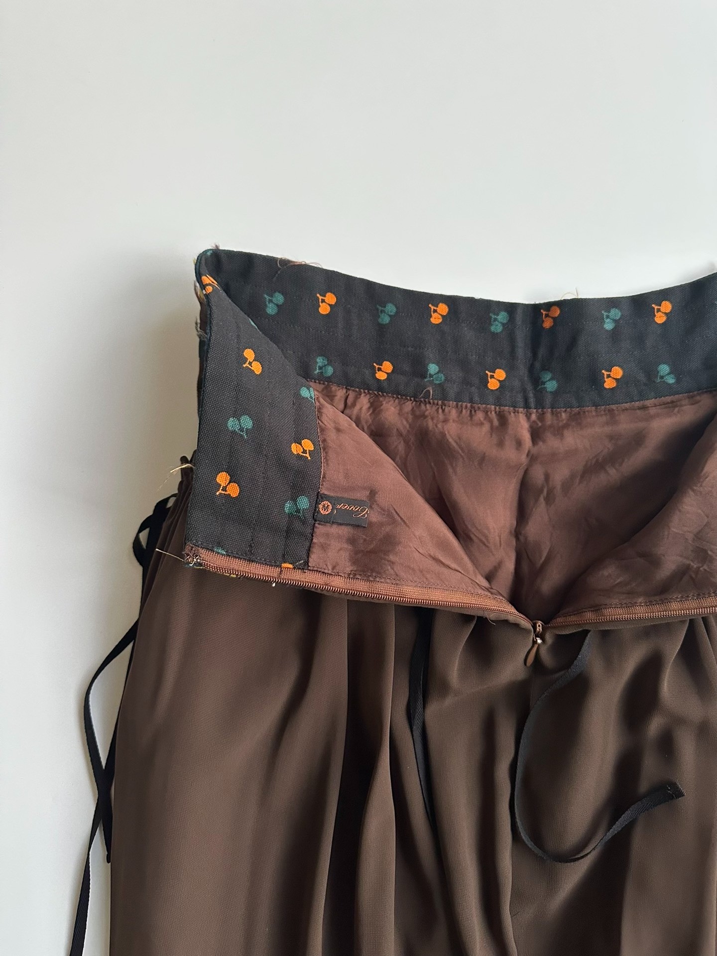 Undercover Early Layered Pattern Skirt — label