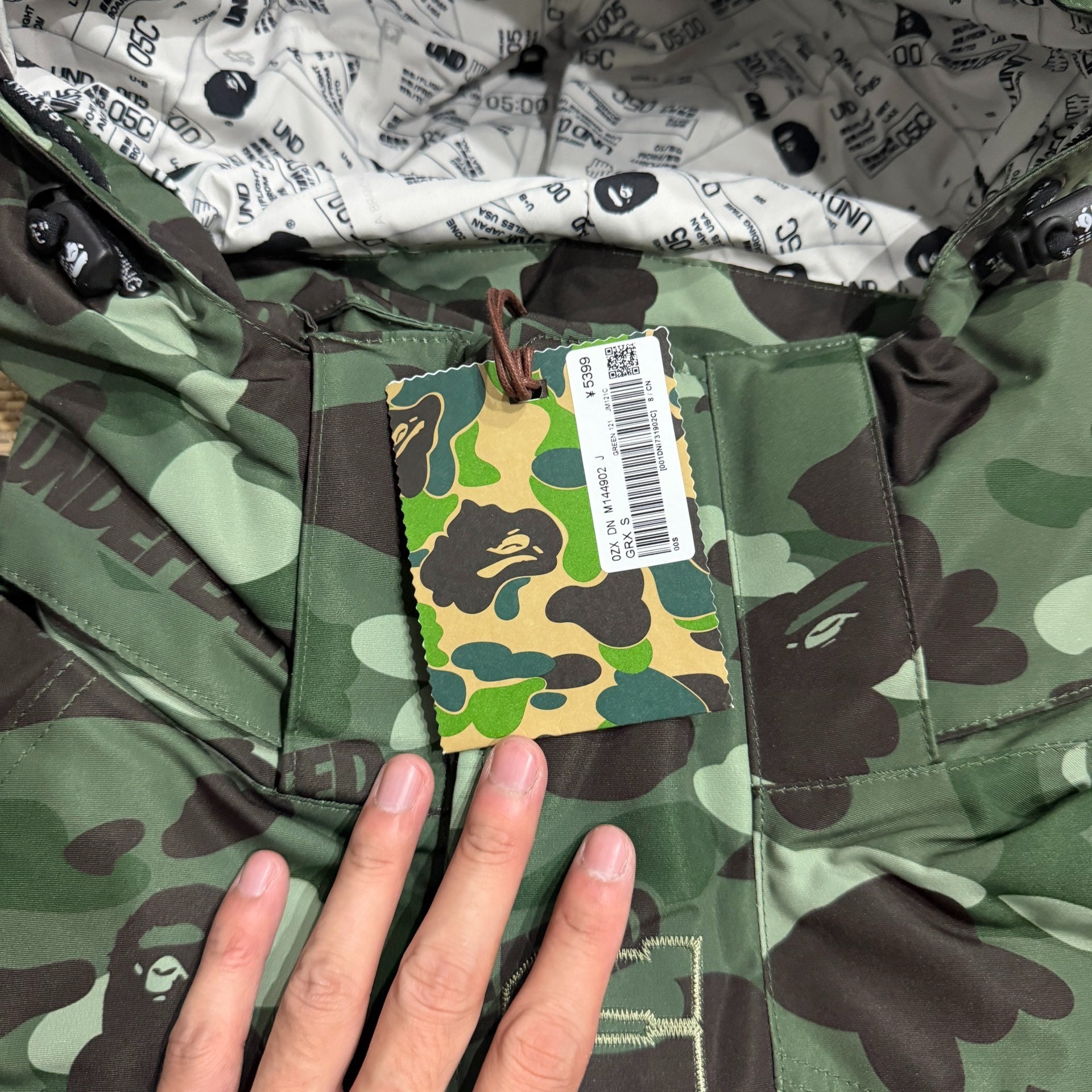 Bape x Undefeated Camo Zip Hooded Jacket — label