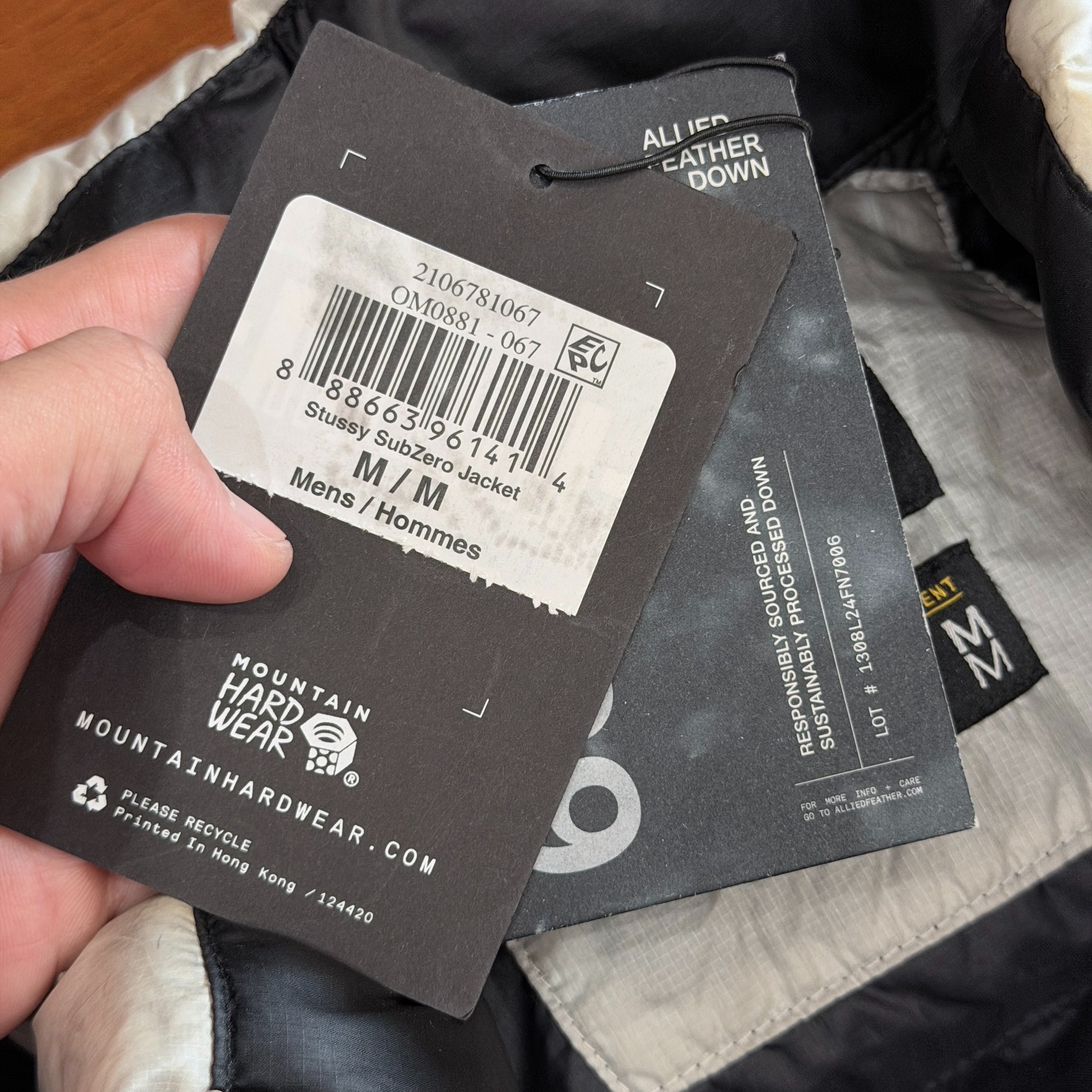 Stussy x Mountain Hardwear White Camo Puffer — label