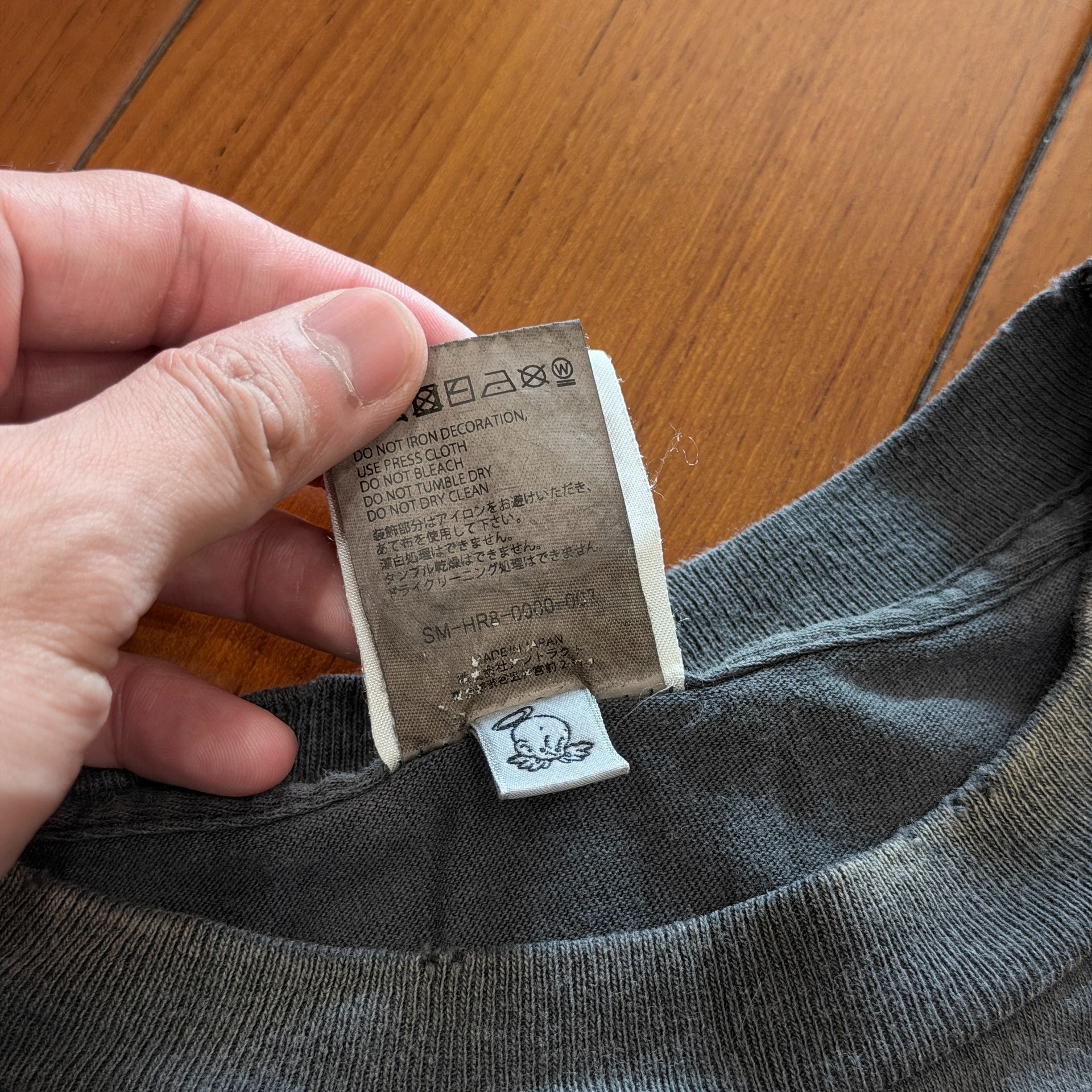 Saint Michael Dinosaur Egg Faded Tee — label