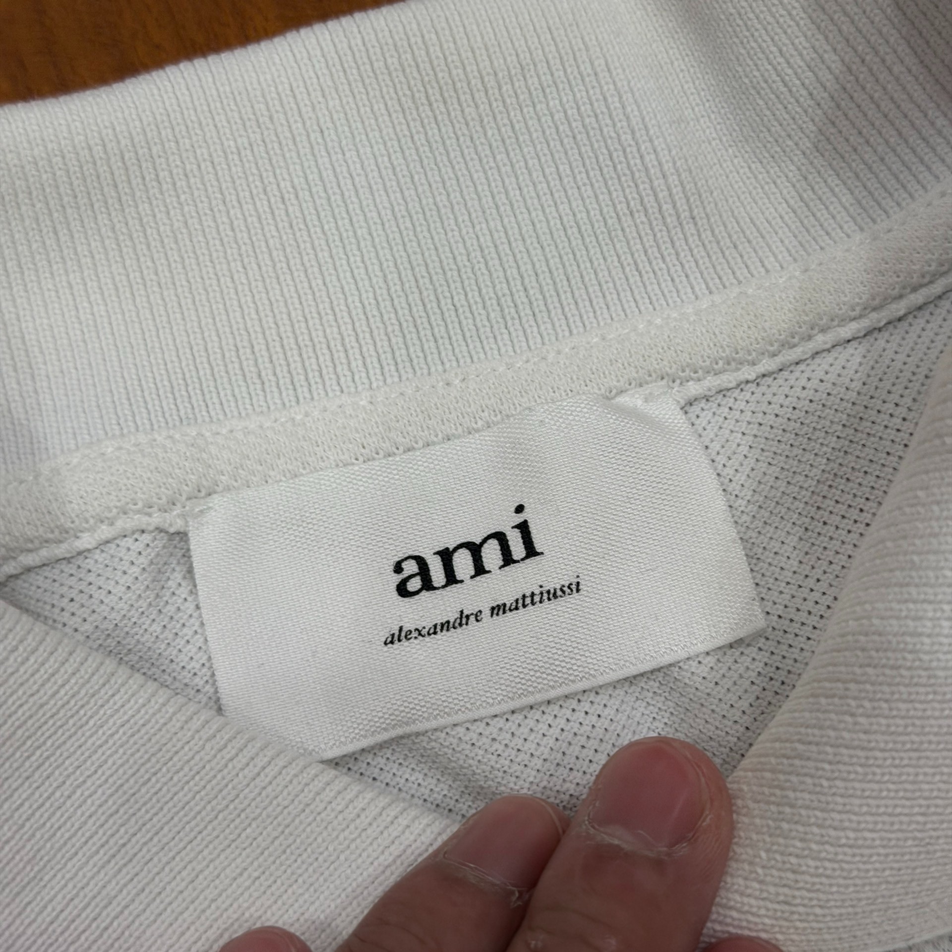 AMI Paris White Heart Logo Polo Shirt — label