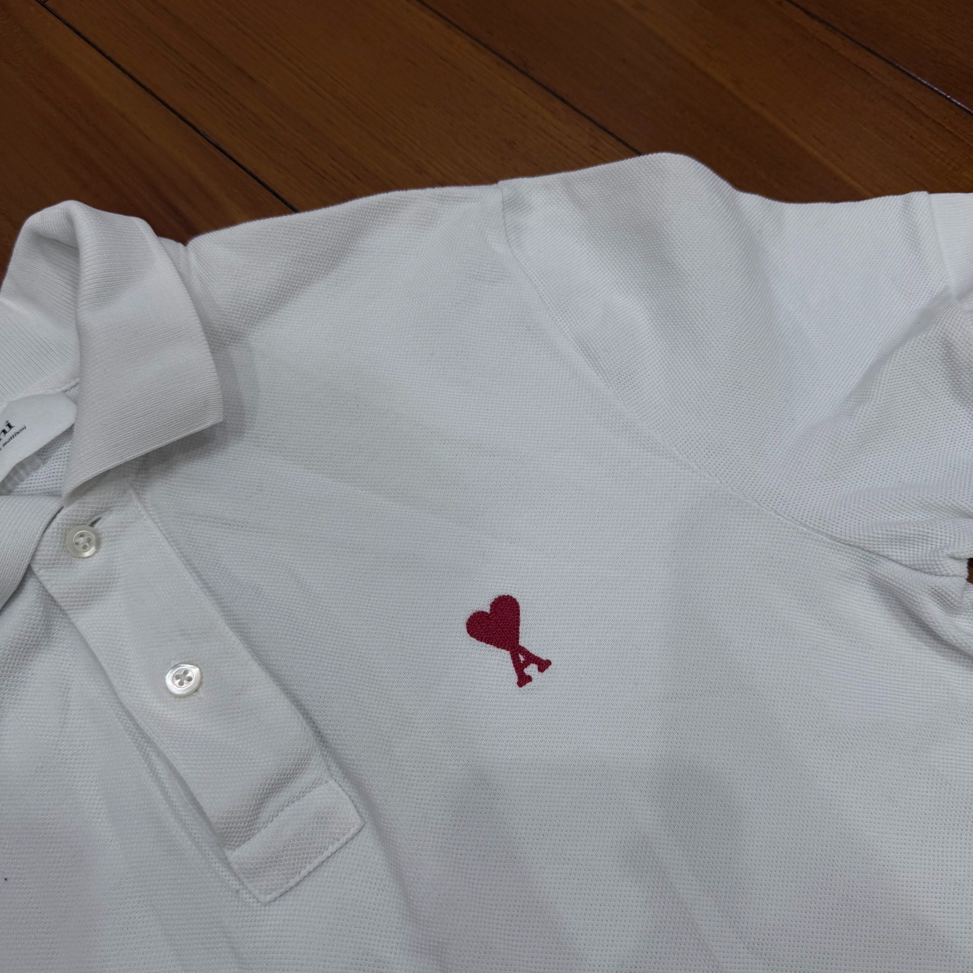 AMI Paris White Heart Logo Polo Shirt — detail