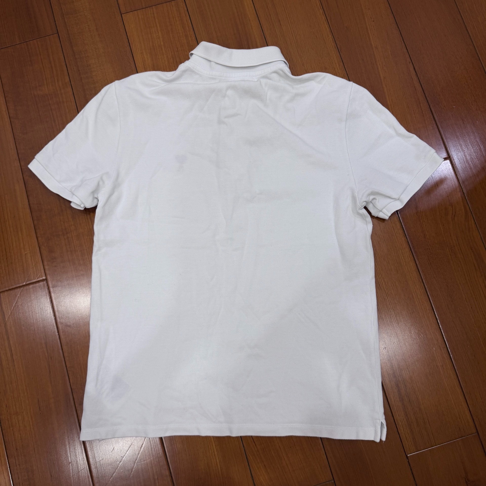 AMI Paris White Heart Logo Polo Shirt — front