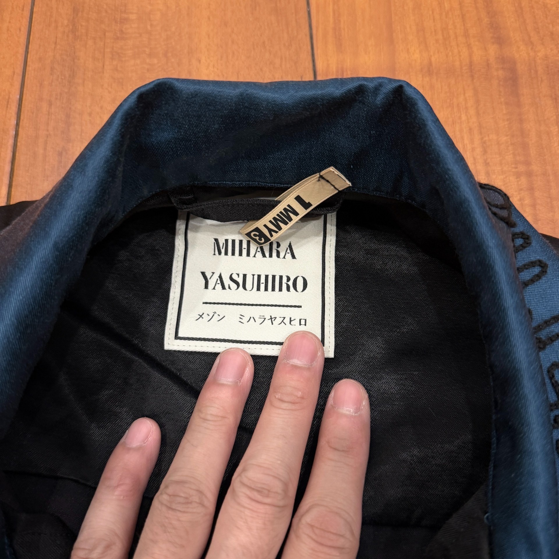 Maison Mihara MMY Black Teal Silk Jacket — label