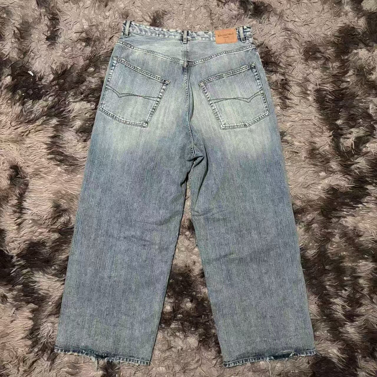 Balenciaga Distressed Wide-Leg Denim Jeans — front