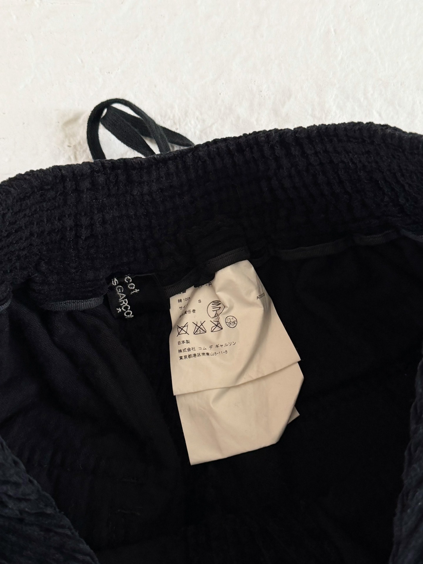 Comme des Garcons Flared Corduroy Pants — label