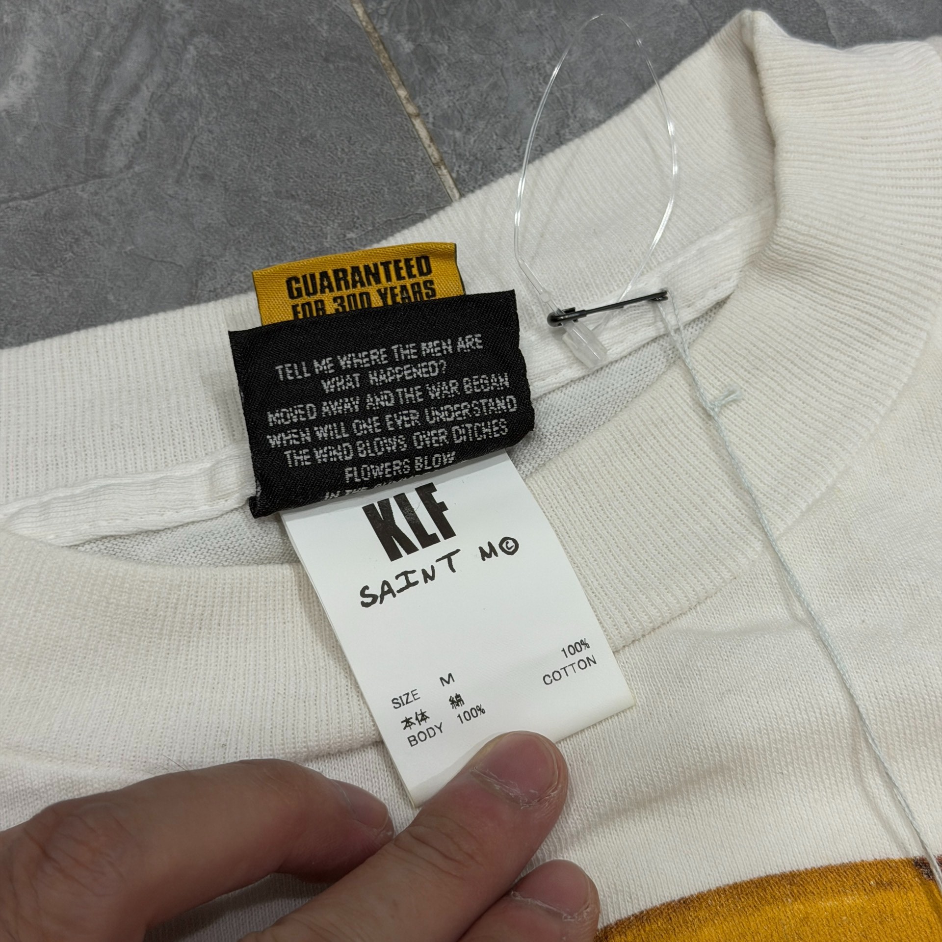 Saint Michael KLF Distressed Smiley Tee — label