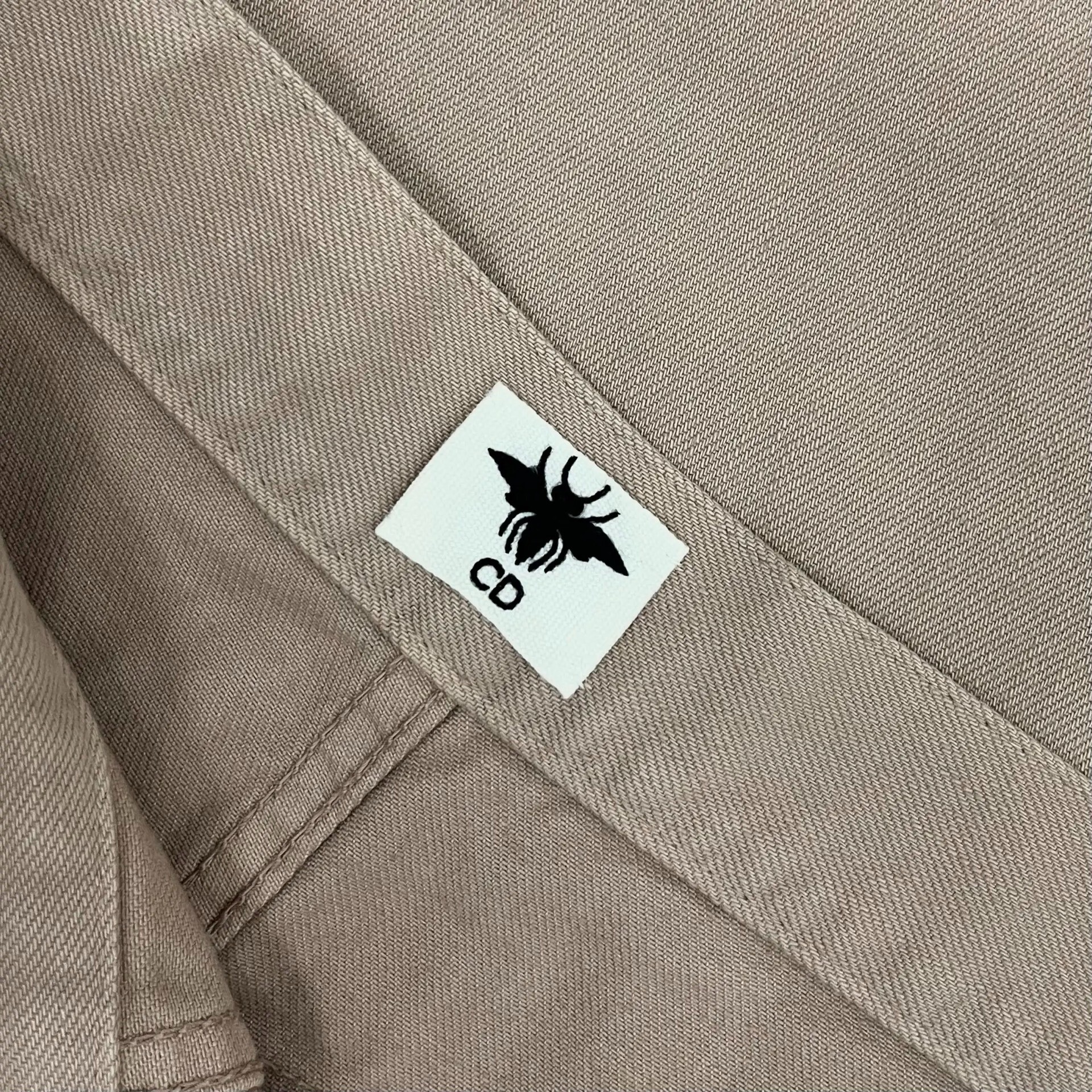 Dior Light Khaki Casual Nine-point Pants — label