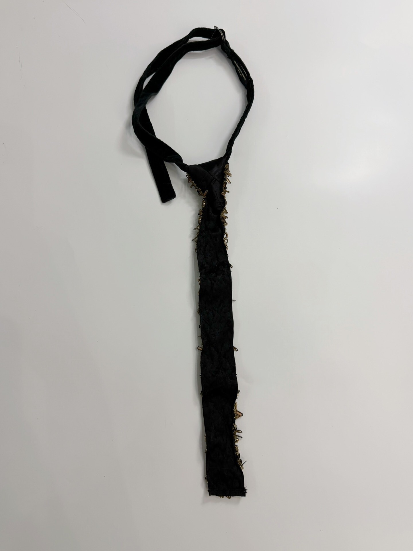 Comme des Garçons Metal Decorated Tie — label