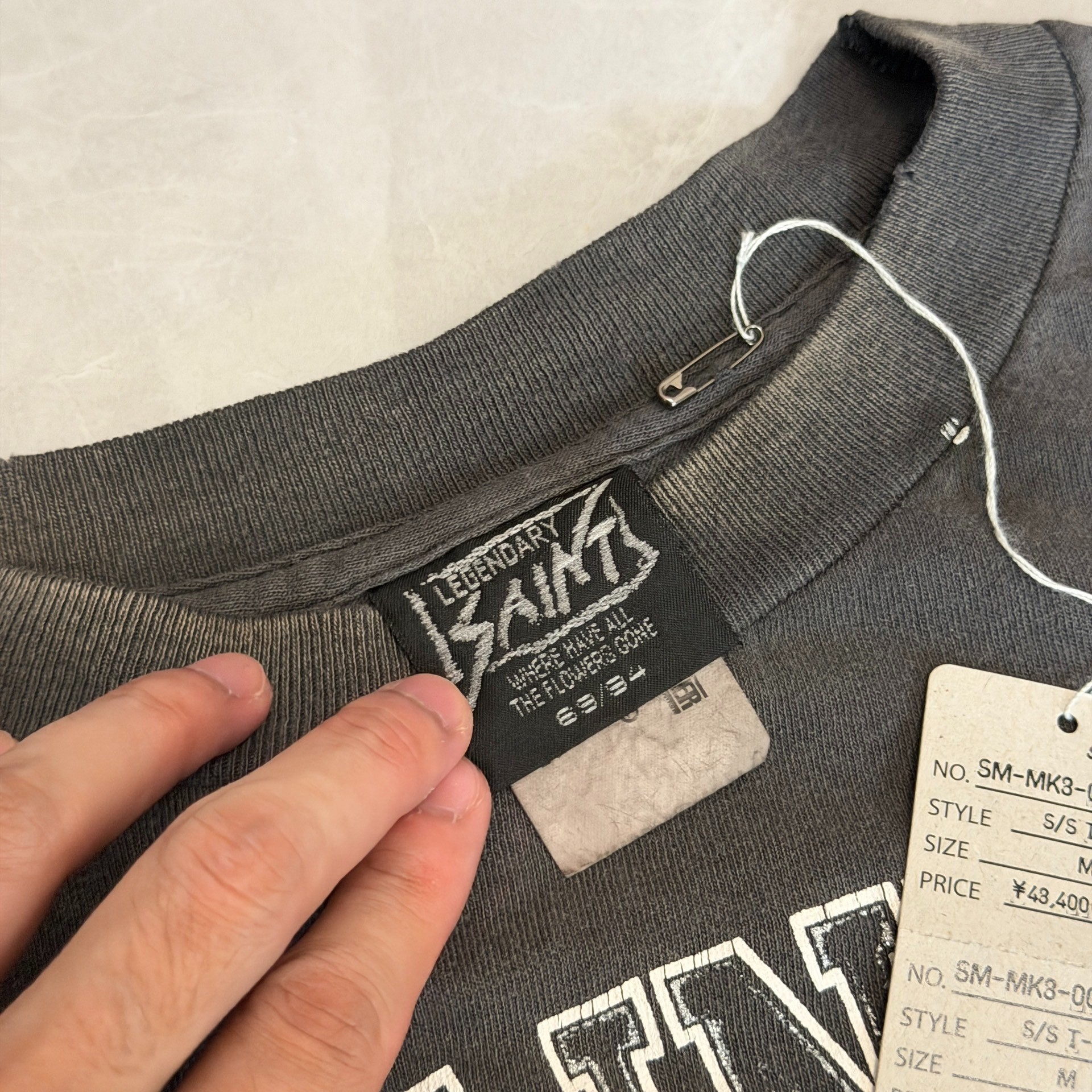Saint Michael x Bounty Hunter Angel Skull Tee — label