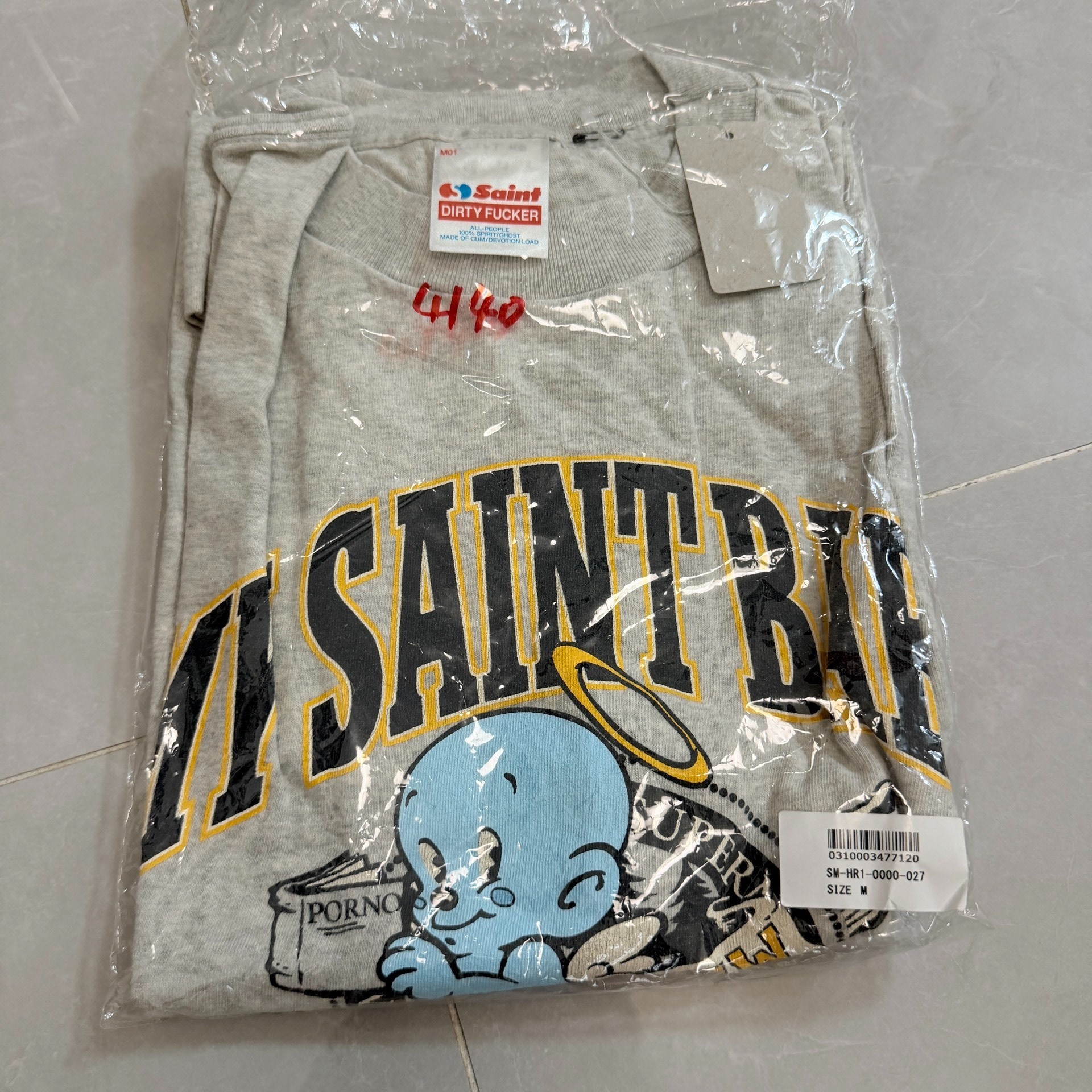 Saint Michael Cartoon Angel Baby T-Shirt — label