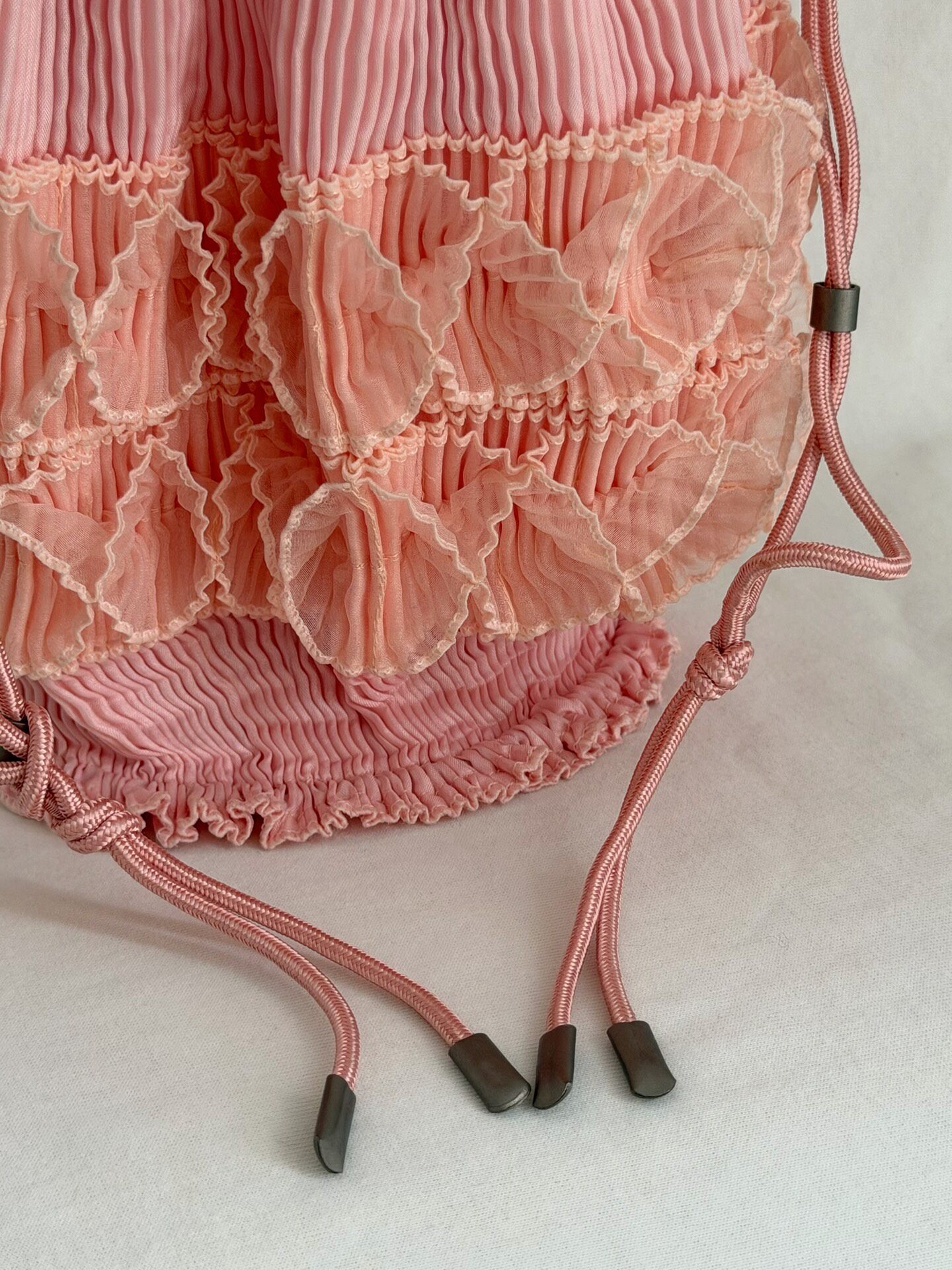 Issey Miyake Fete Drawstring Bucket Bag — label