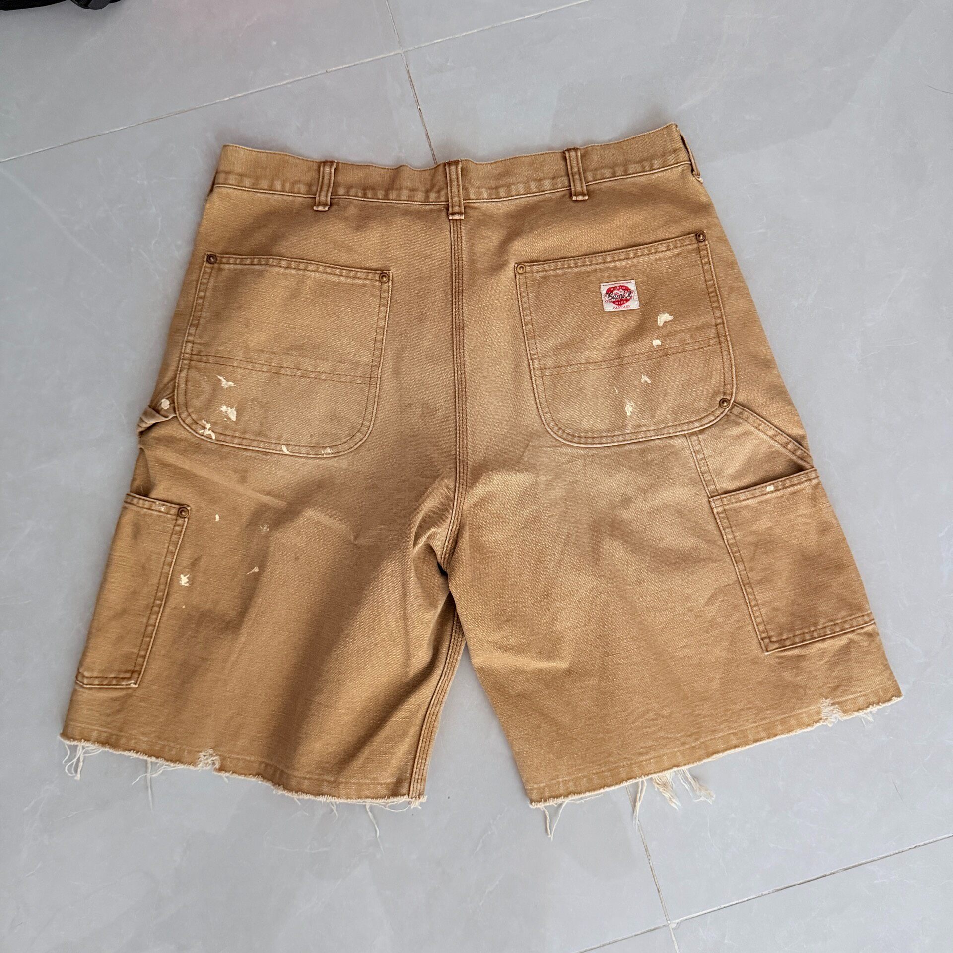 Saint Michael SS25 Distressed Denim Work Shorts — front