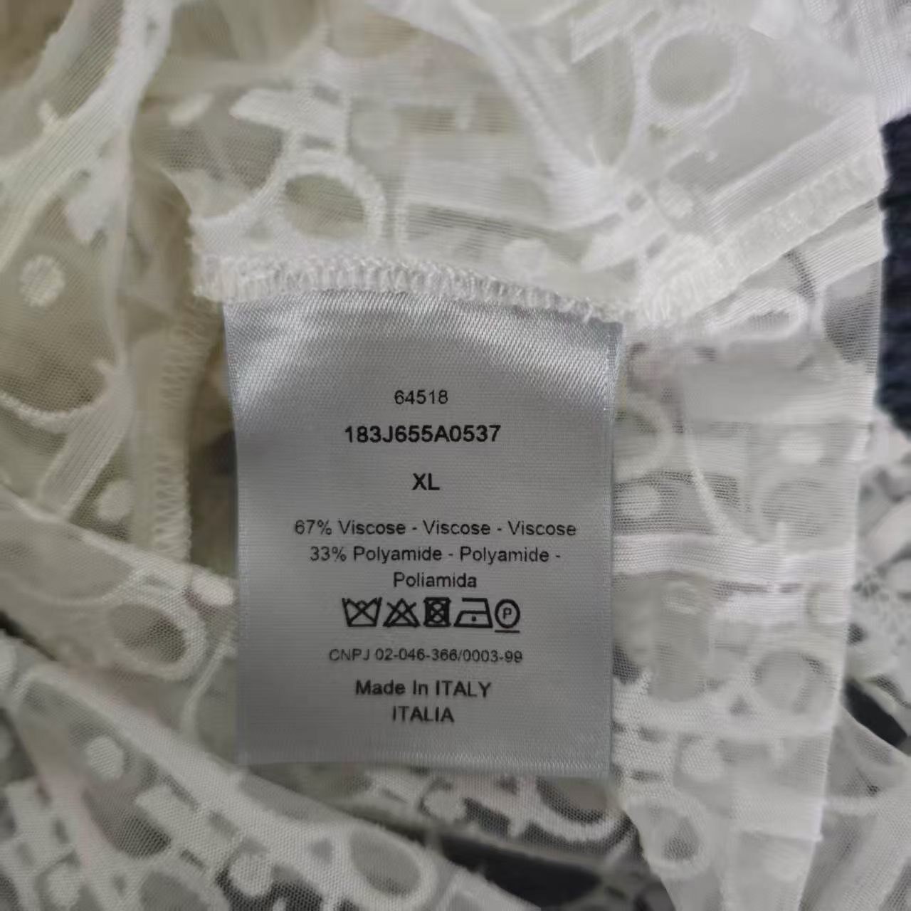 Dior Monogram Lace Long Sleeve Top — label