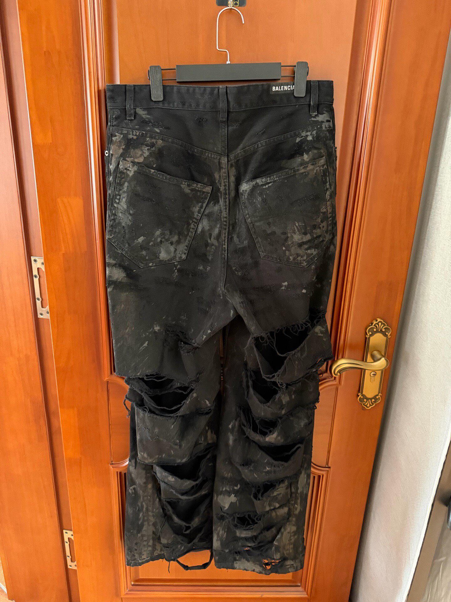 Balenciaga Black Distressed Mud Jeans — front