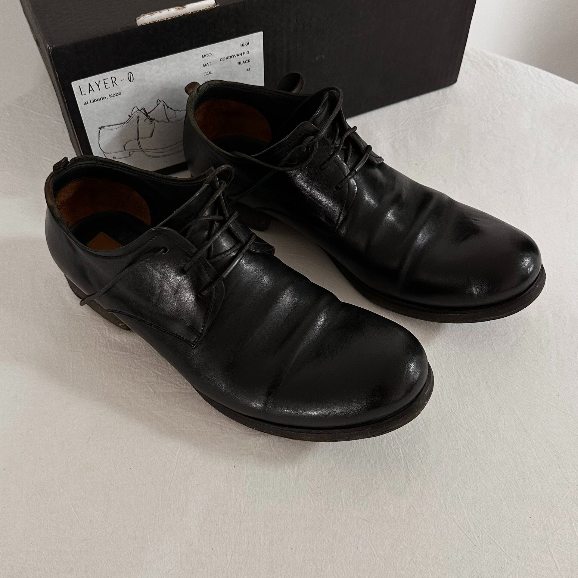 LAYER-0 Black Cordovan Derby Shoes — label