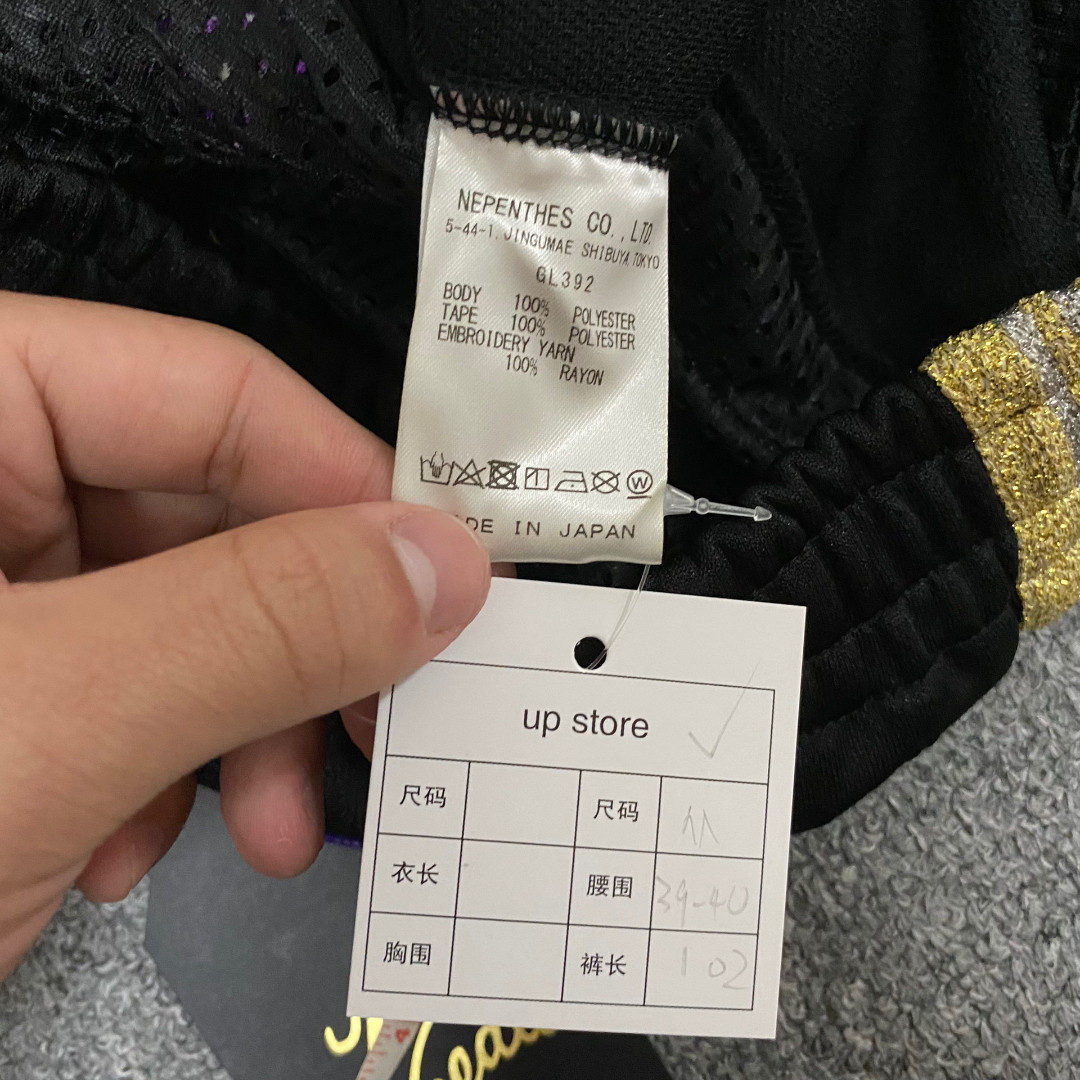Needles 25th Anniversary Gold Glitter Track Pants — label