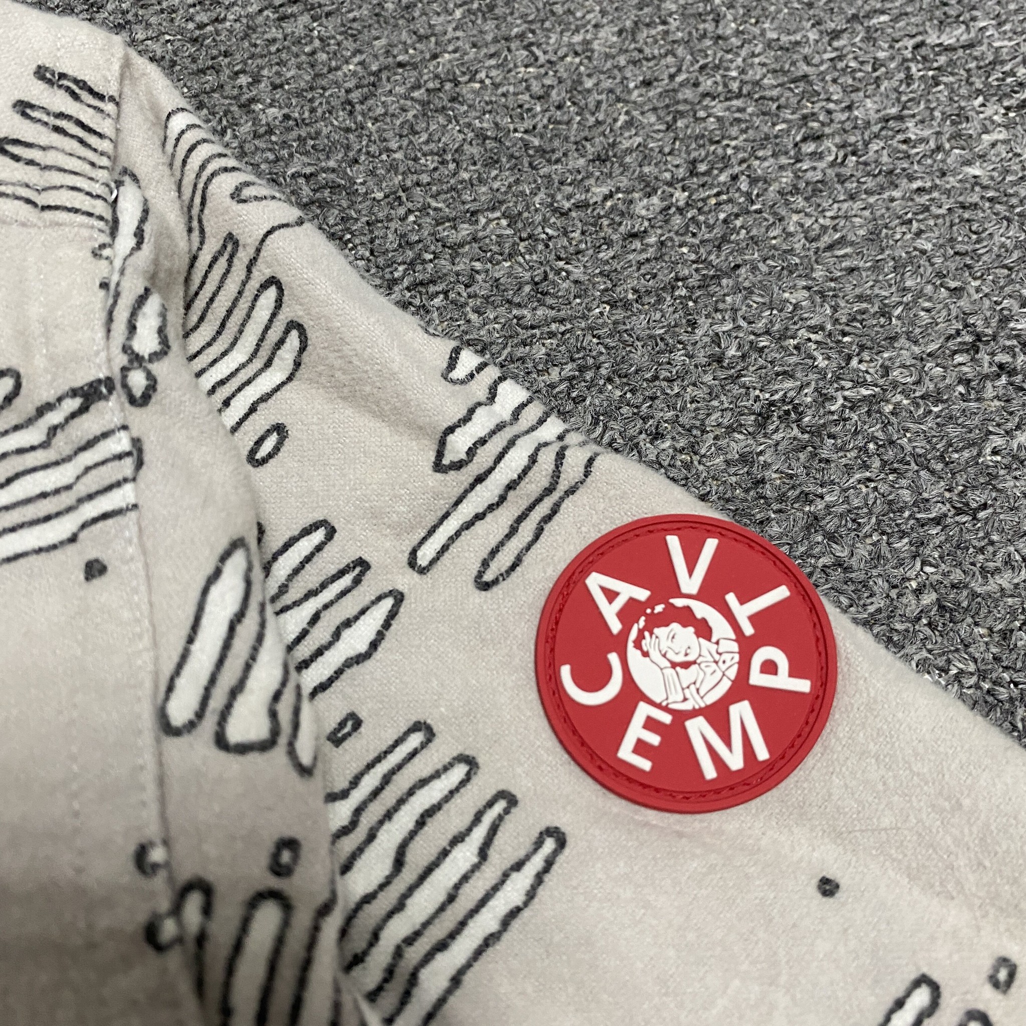 CAVEMPT Noise Flannel Shirt Jacket — label