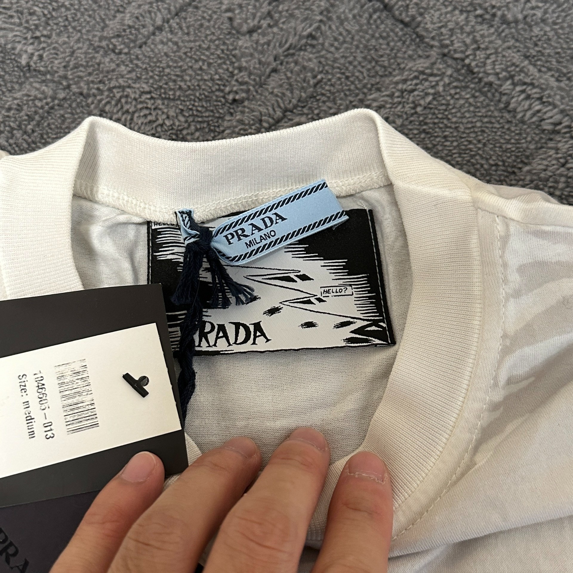 Prada Cartoon Graphic Short Sleeve Tee — label
