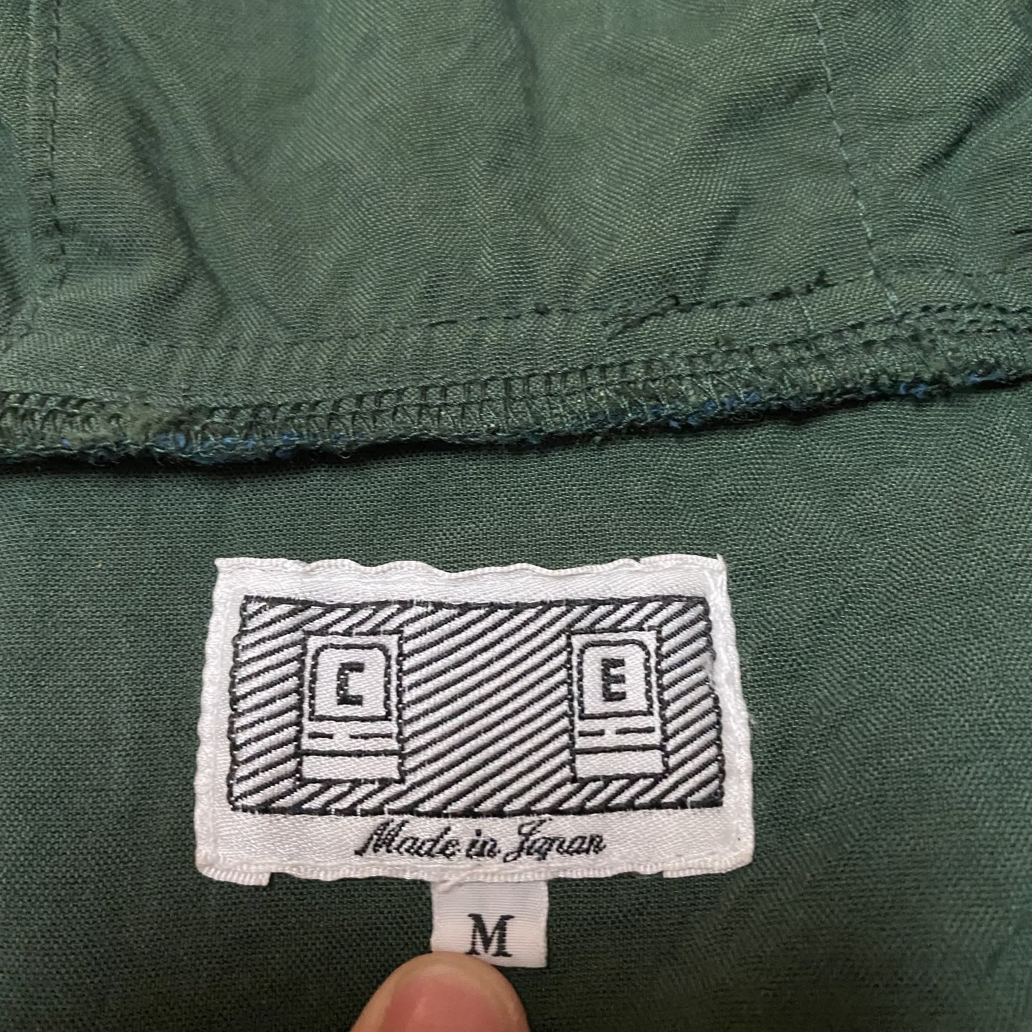 CAV EMPT 19SS Reflective Hooded Jacket — label