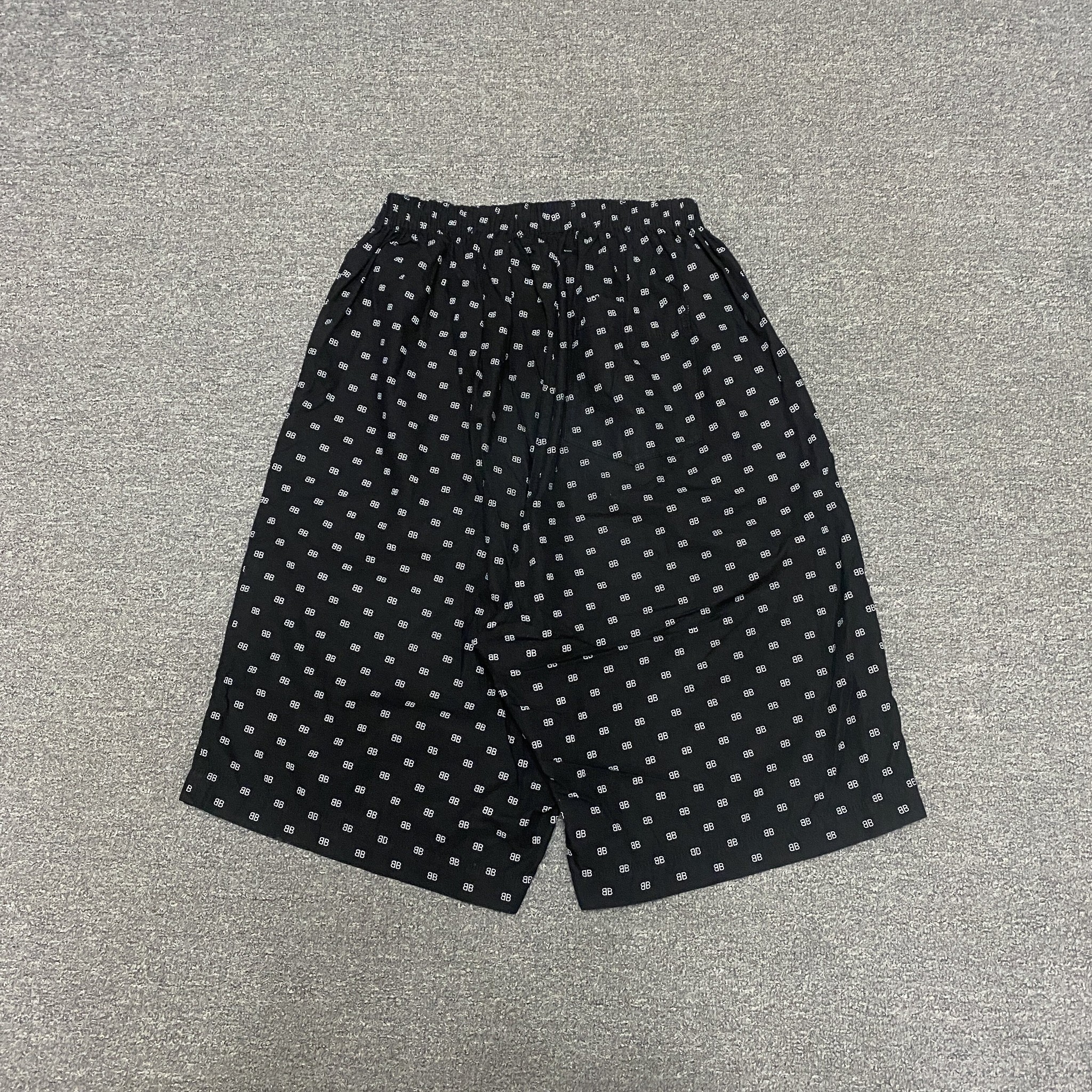 Balenciaga All Over Logo Shorts — front