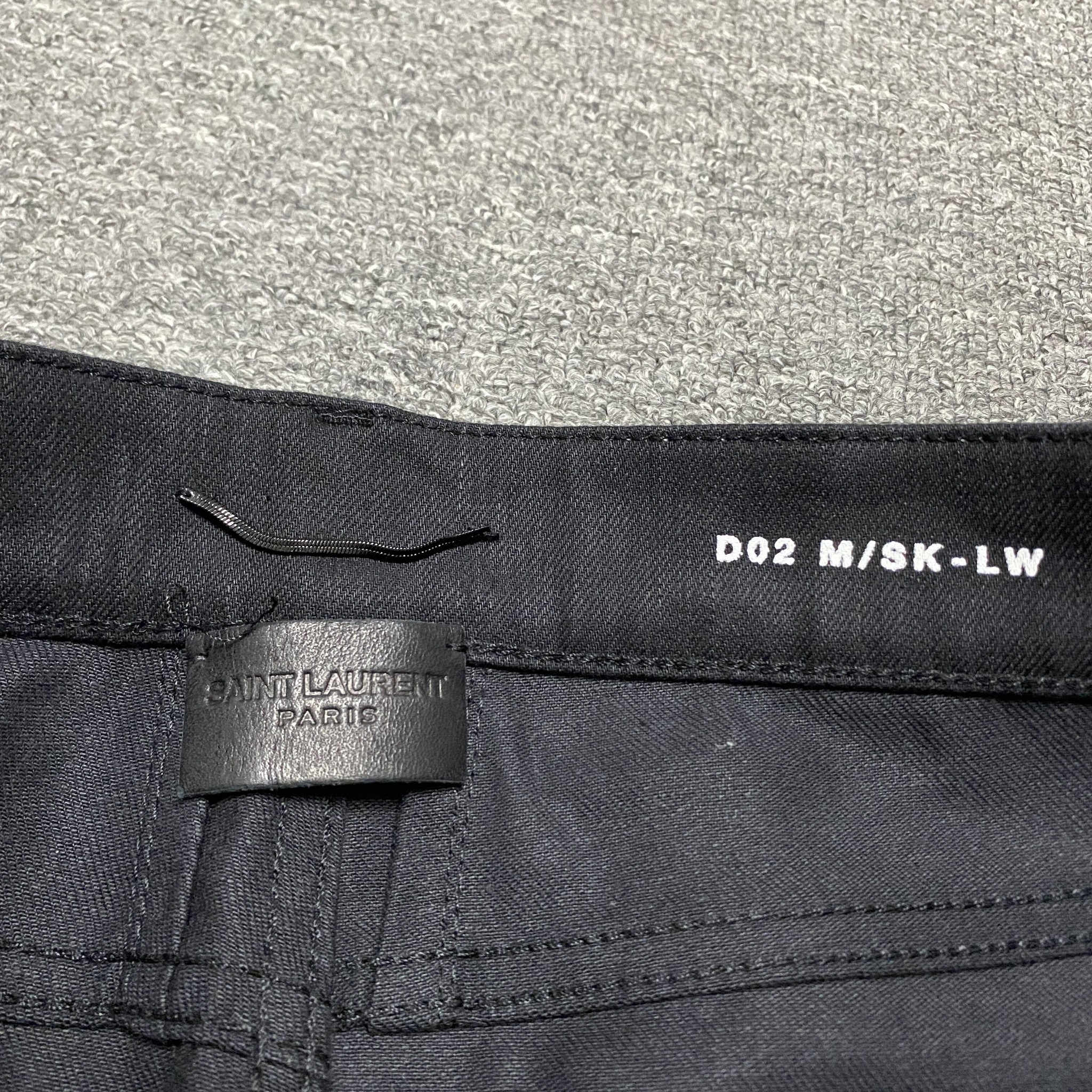 Saint Laurent Distressed Denim Jeans — label