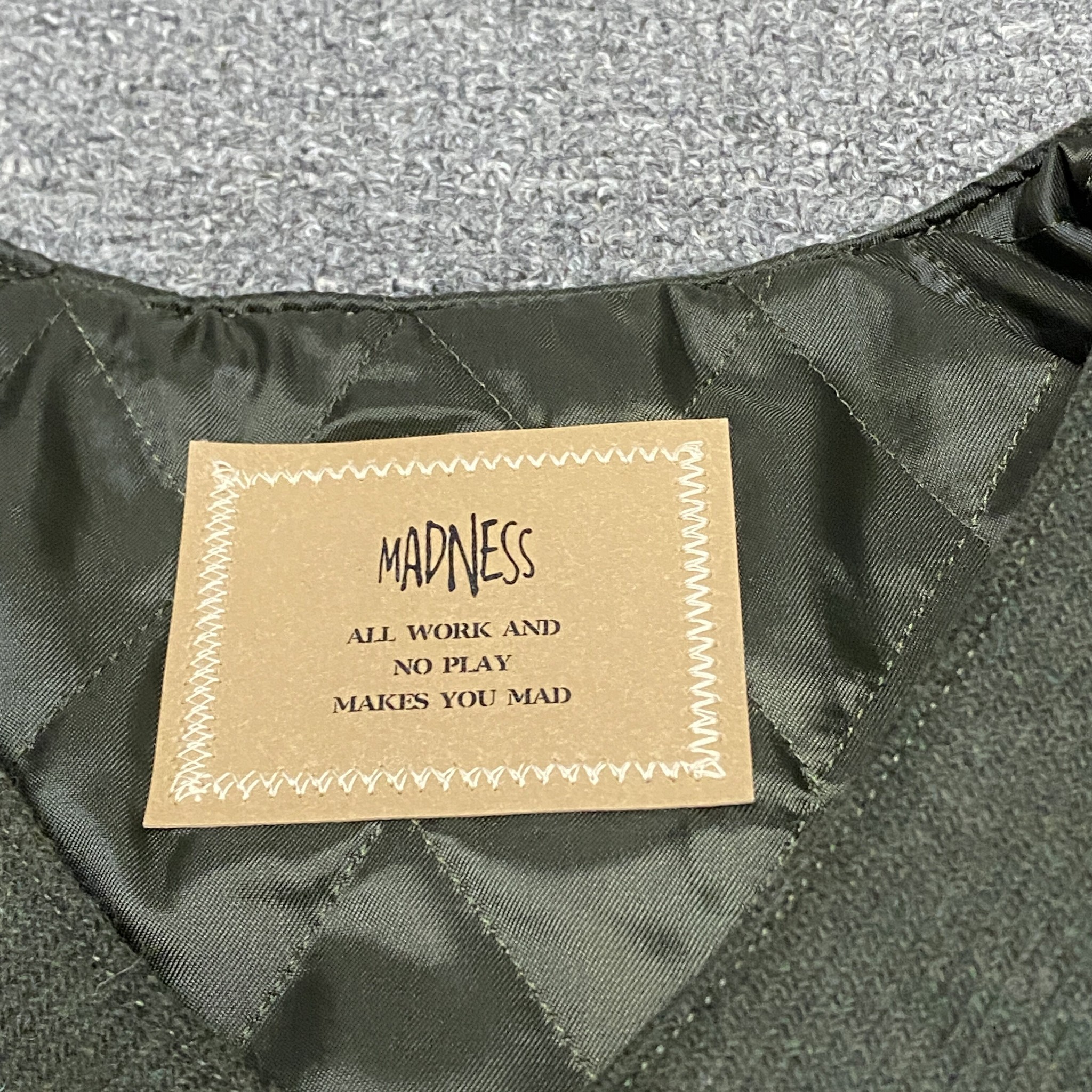 MADNESS 23AW Wool Liner Jacket — label
