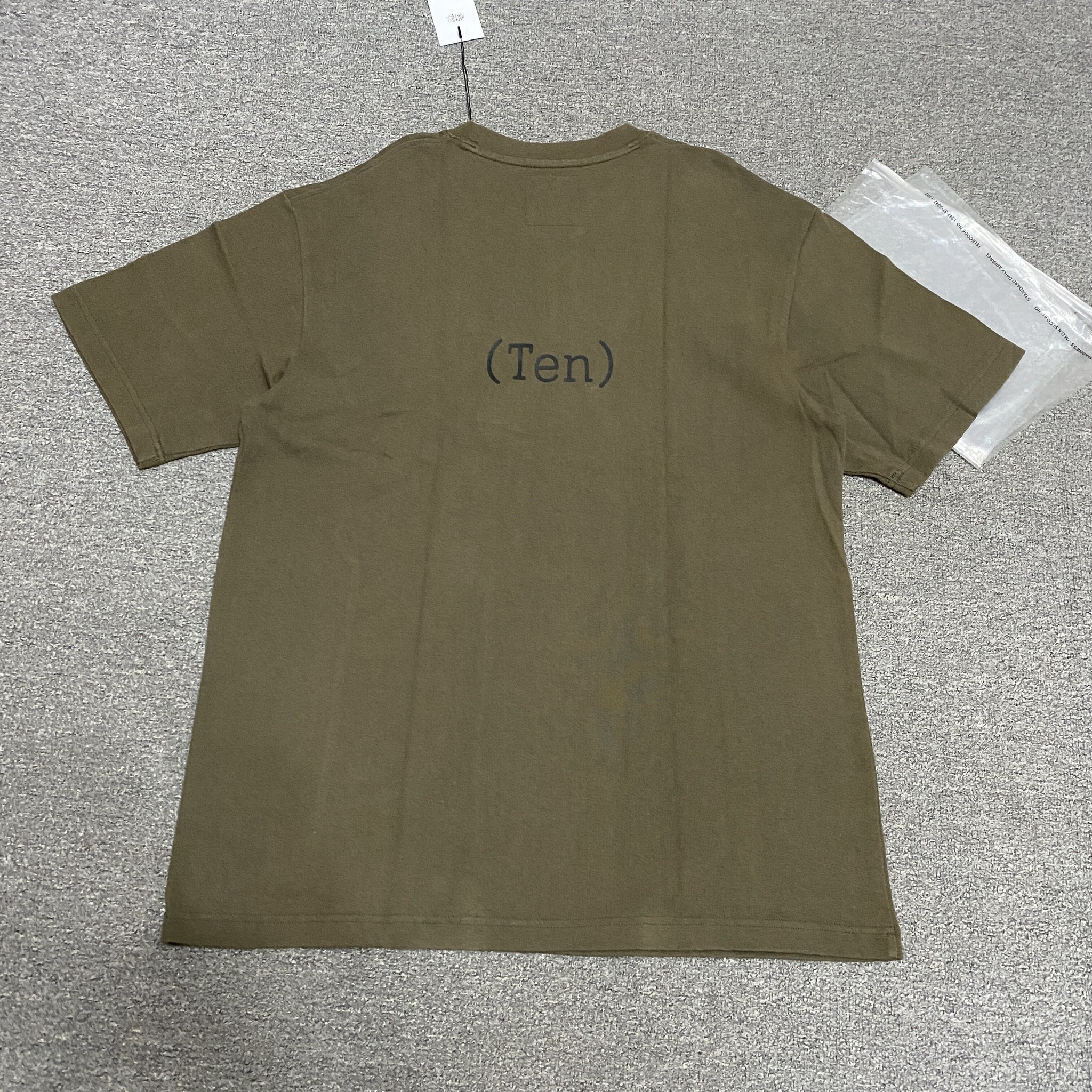 MADNESS 23AW 10th Anniversary Wash Tee — front