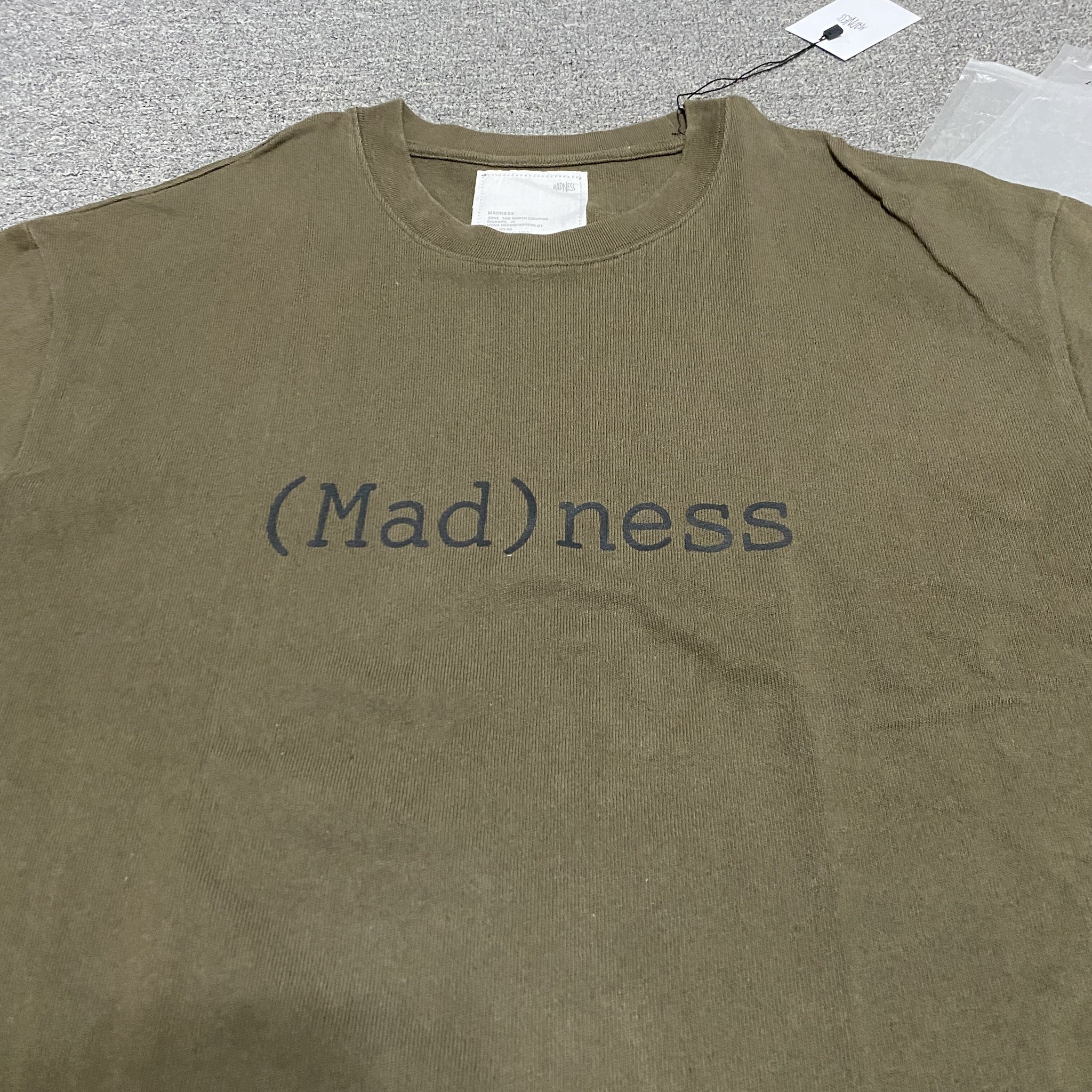 MADNESS 23AW 10th Anniversary Wash Tee — detail