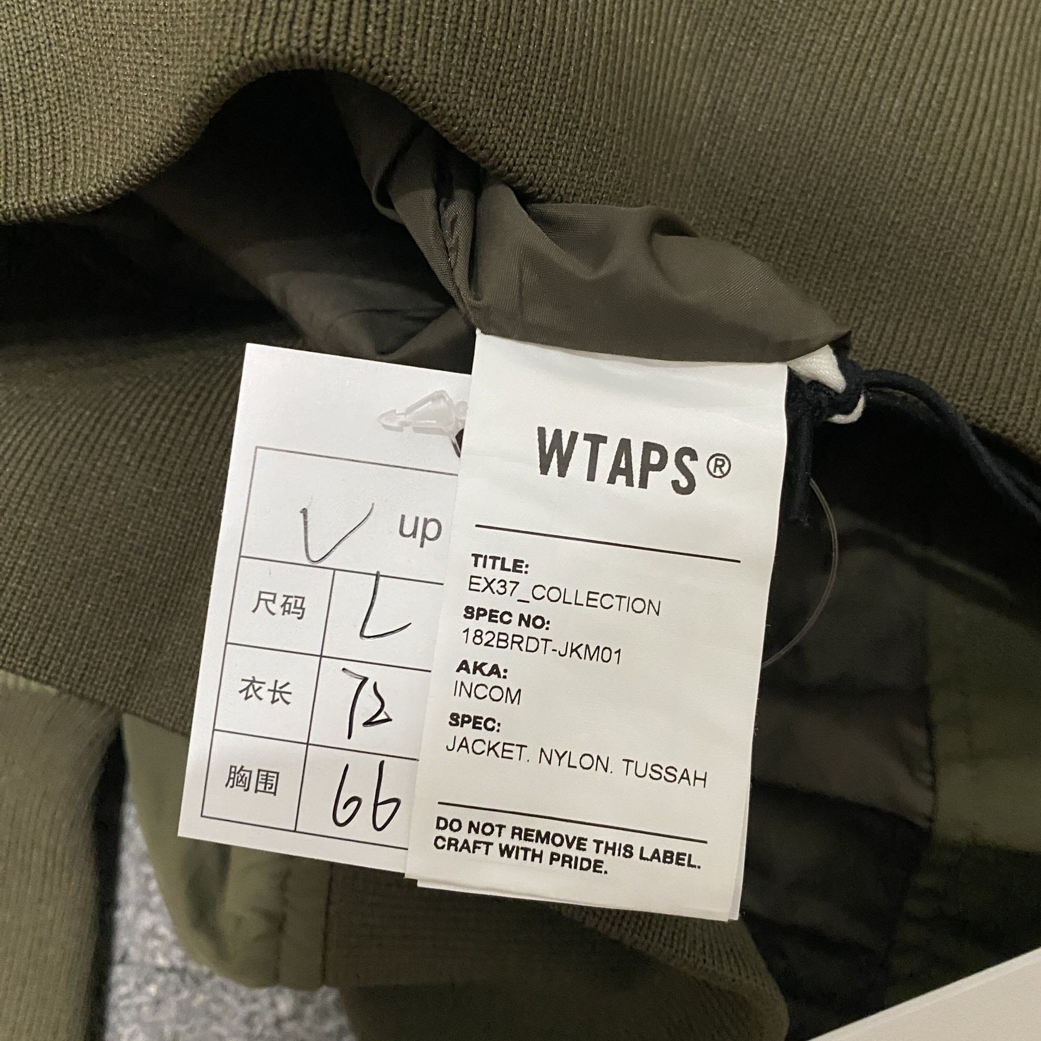 WTAPS 18AW INCOM Olive Jacket — label