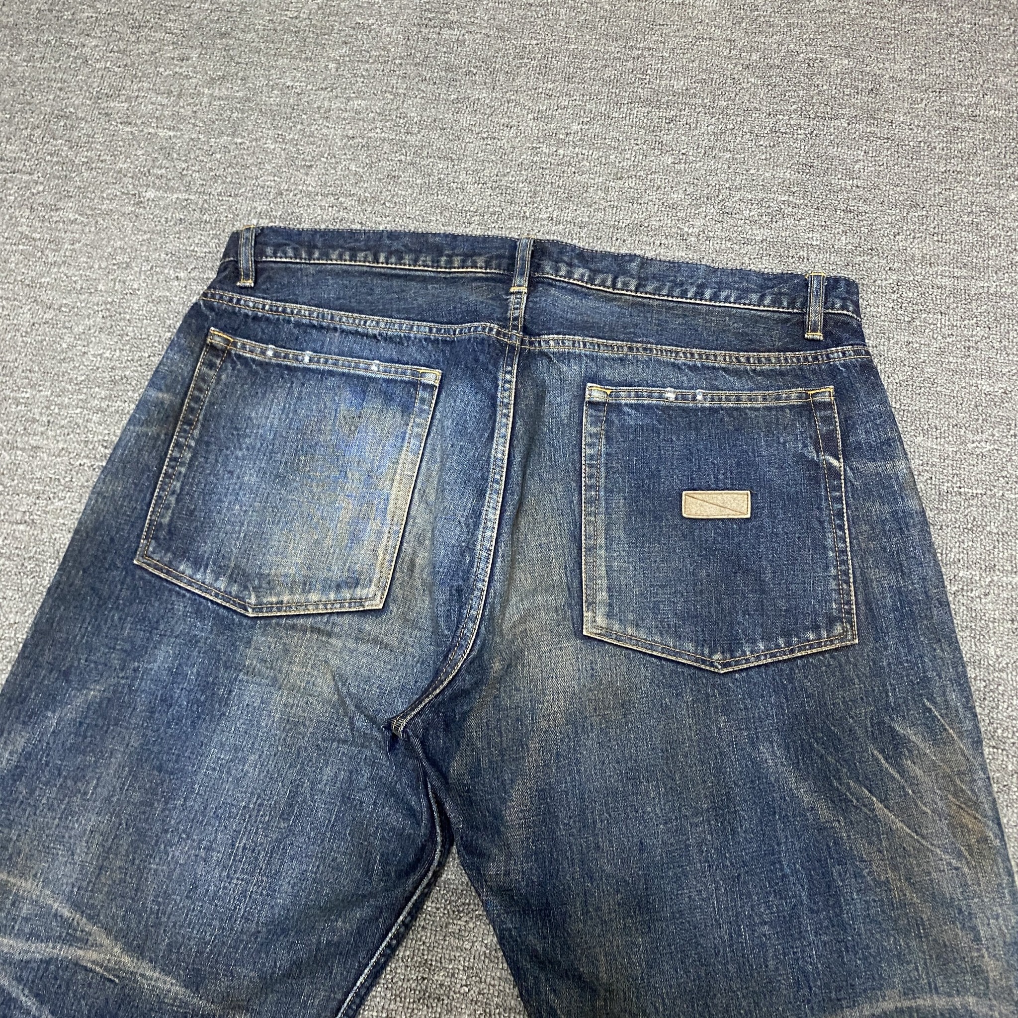 MADNESS 20SS Distressed Denim Jeans — back