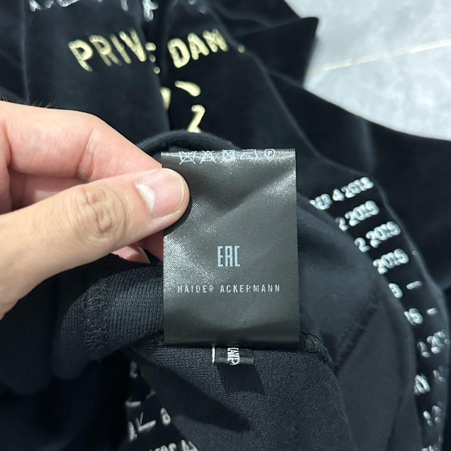 Haider Ackermann Gold Embroidered Velvet Hoodie — label