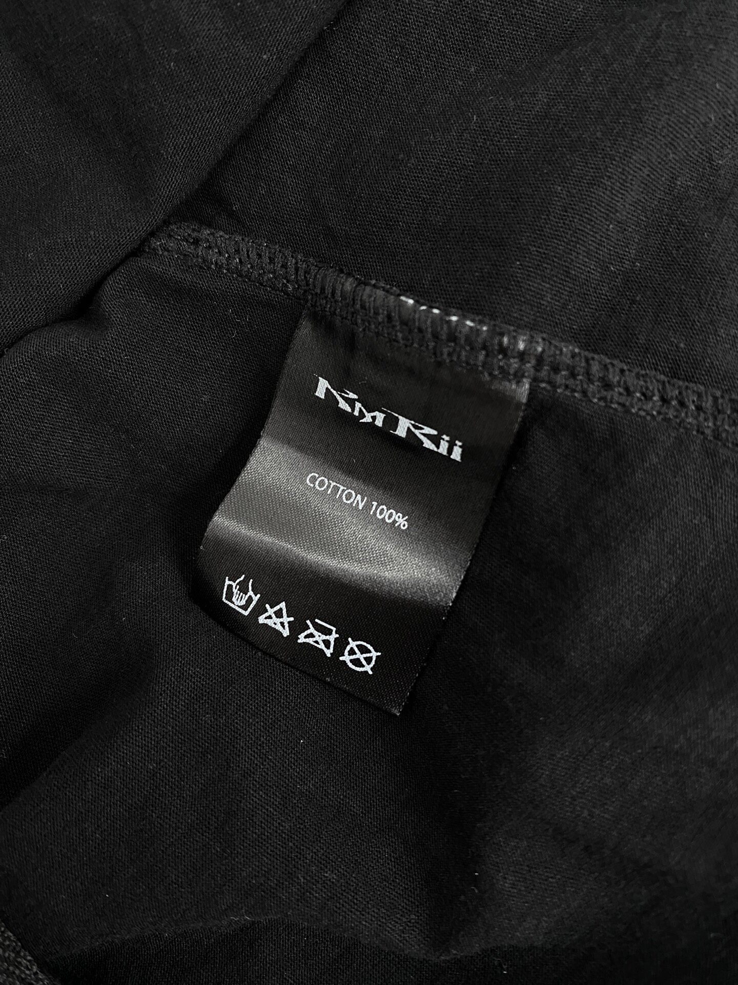 Kmrii Black Long-Sleeve Cotton Top — label