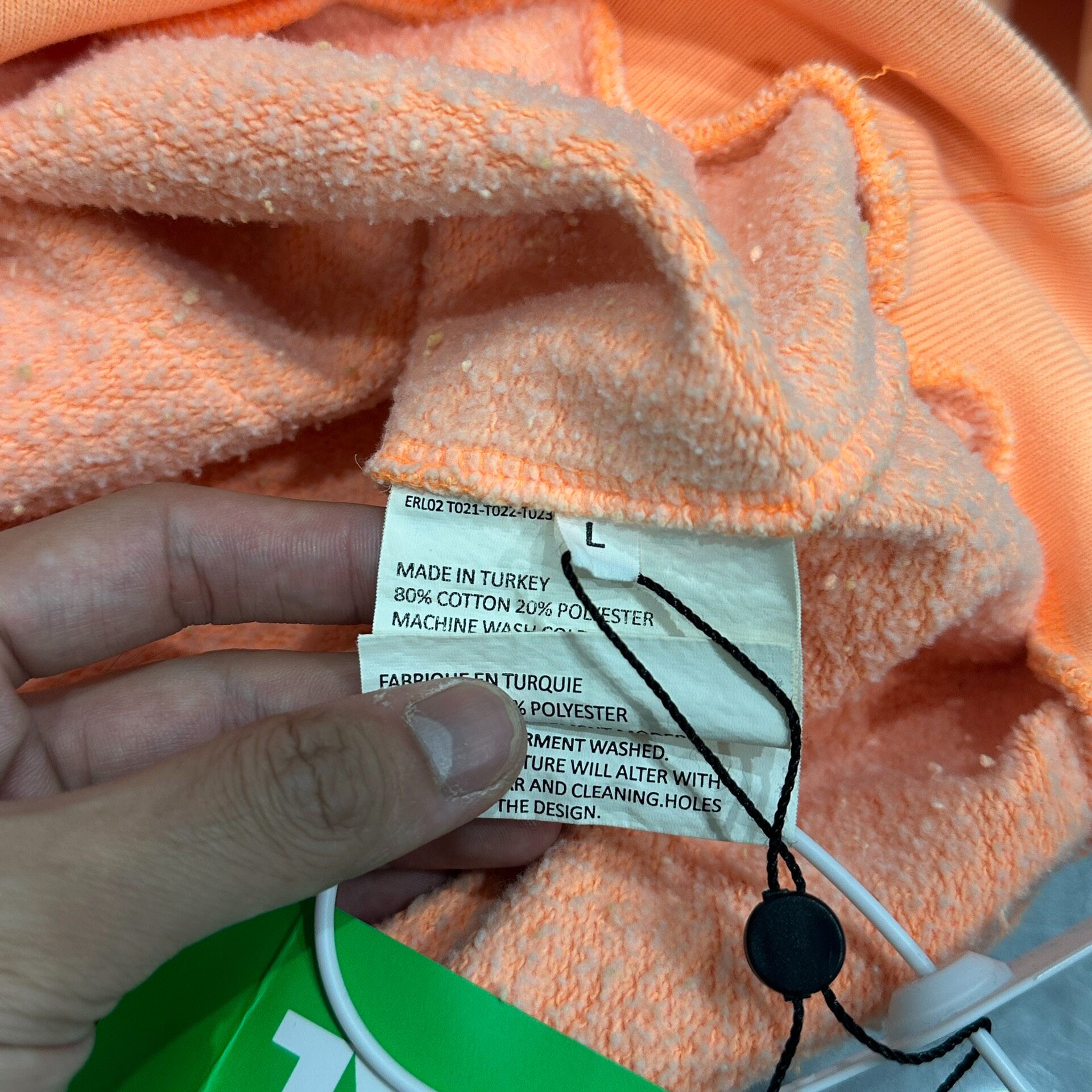 ERL Salmon Orange Hooded Sweatshirt — label