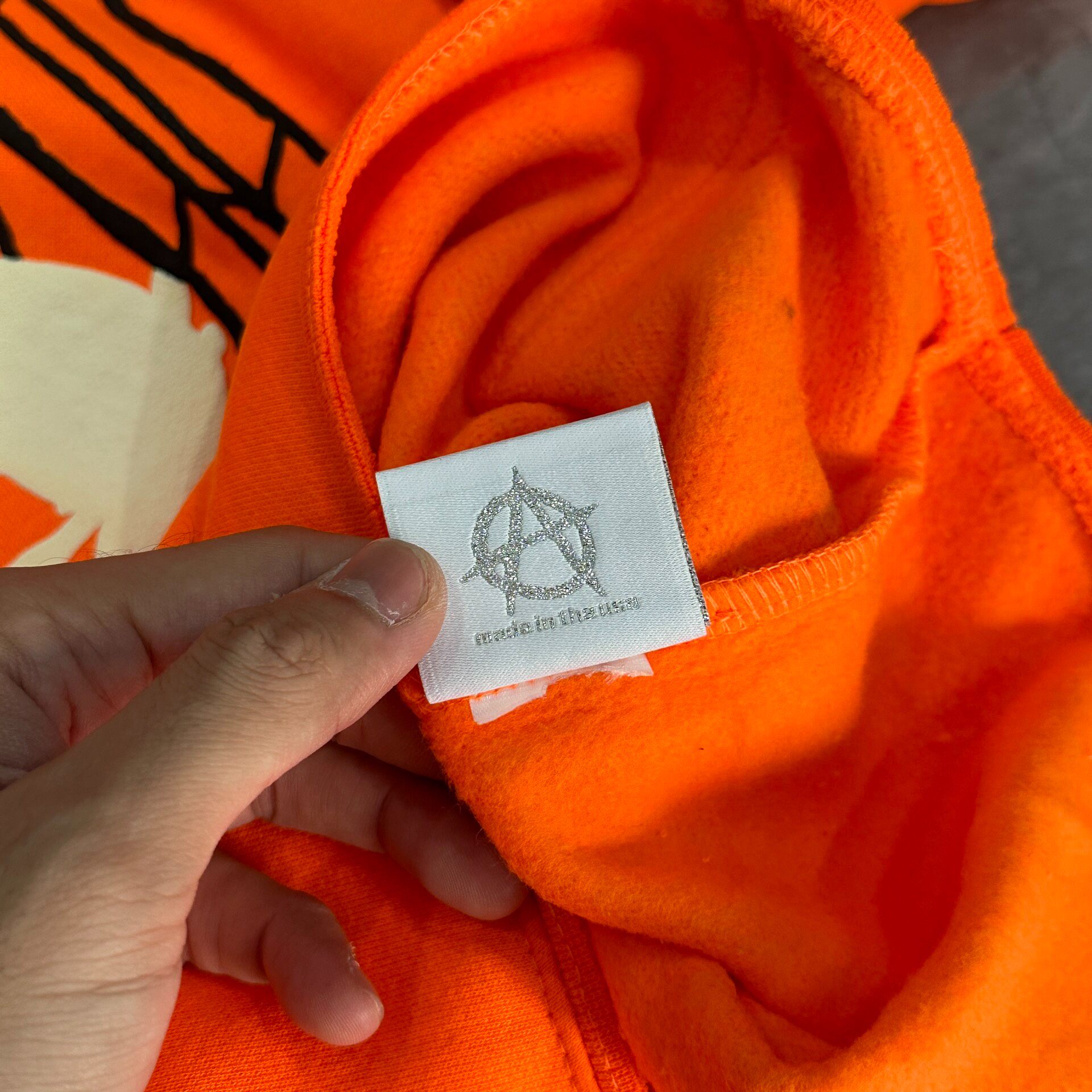Revenge Spider Skull Orange Hoodie — label