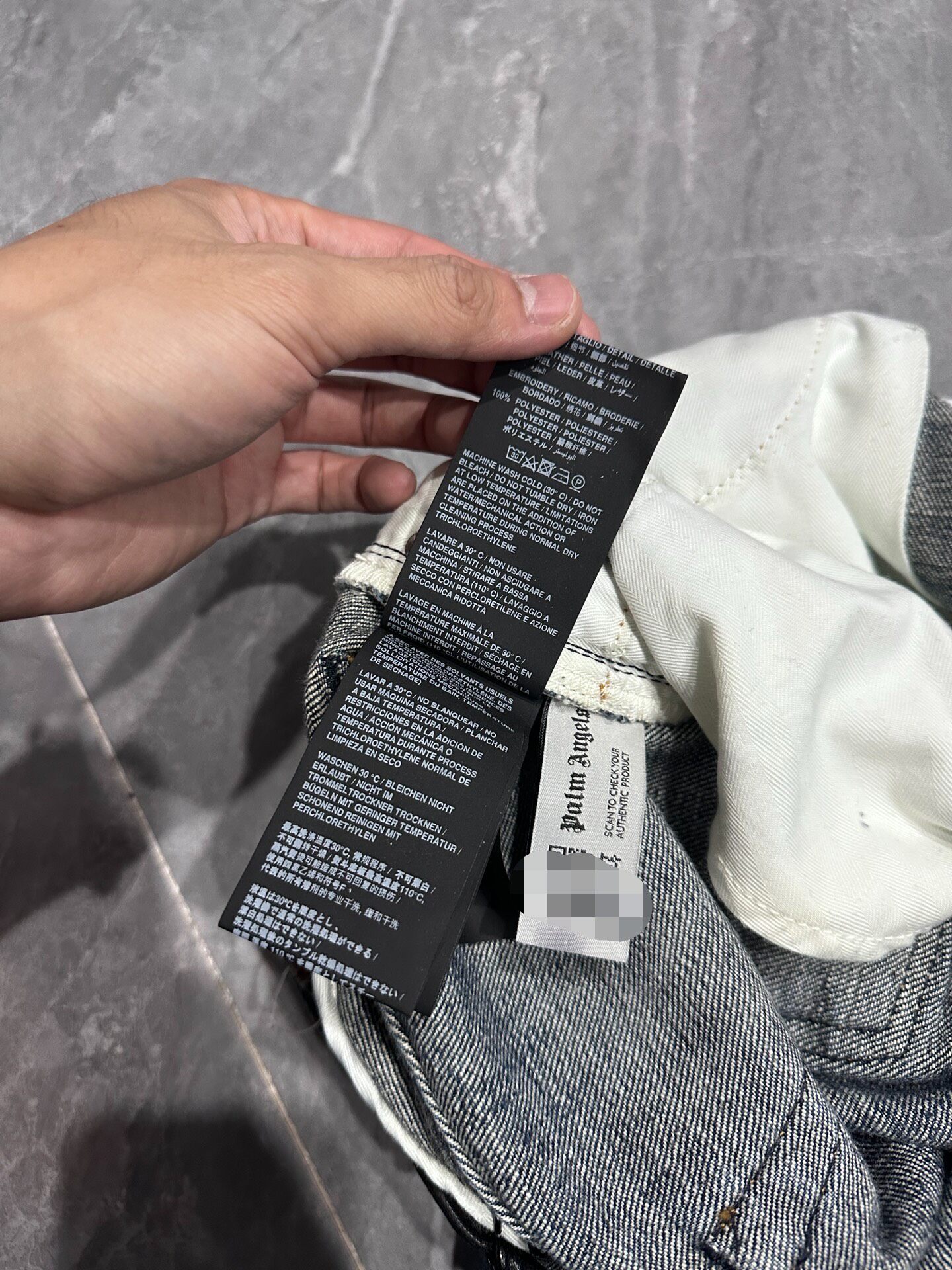 Palm Angels Distressed Denim Jeans — label