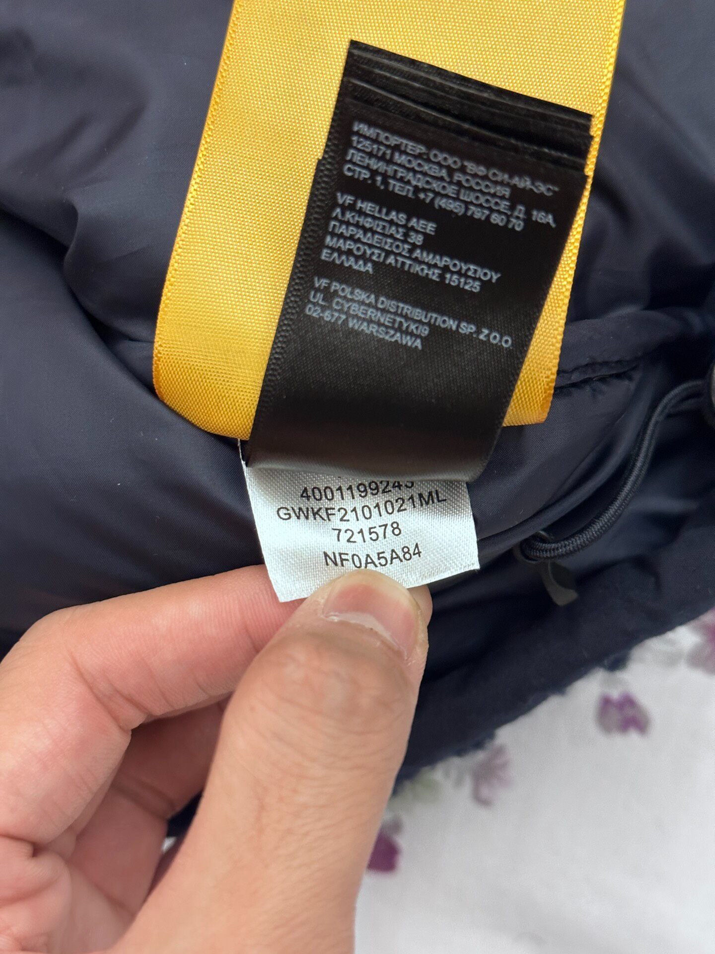 The North Face Navy Fleece Down Jacket — label