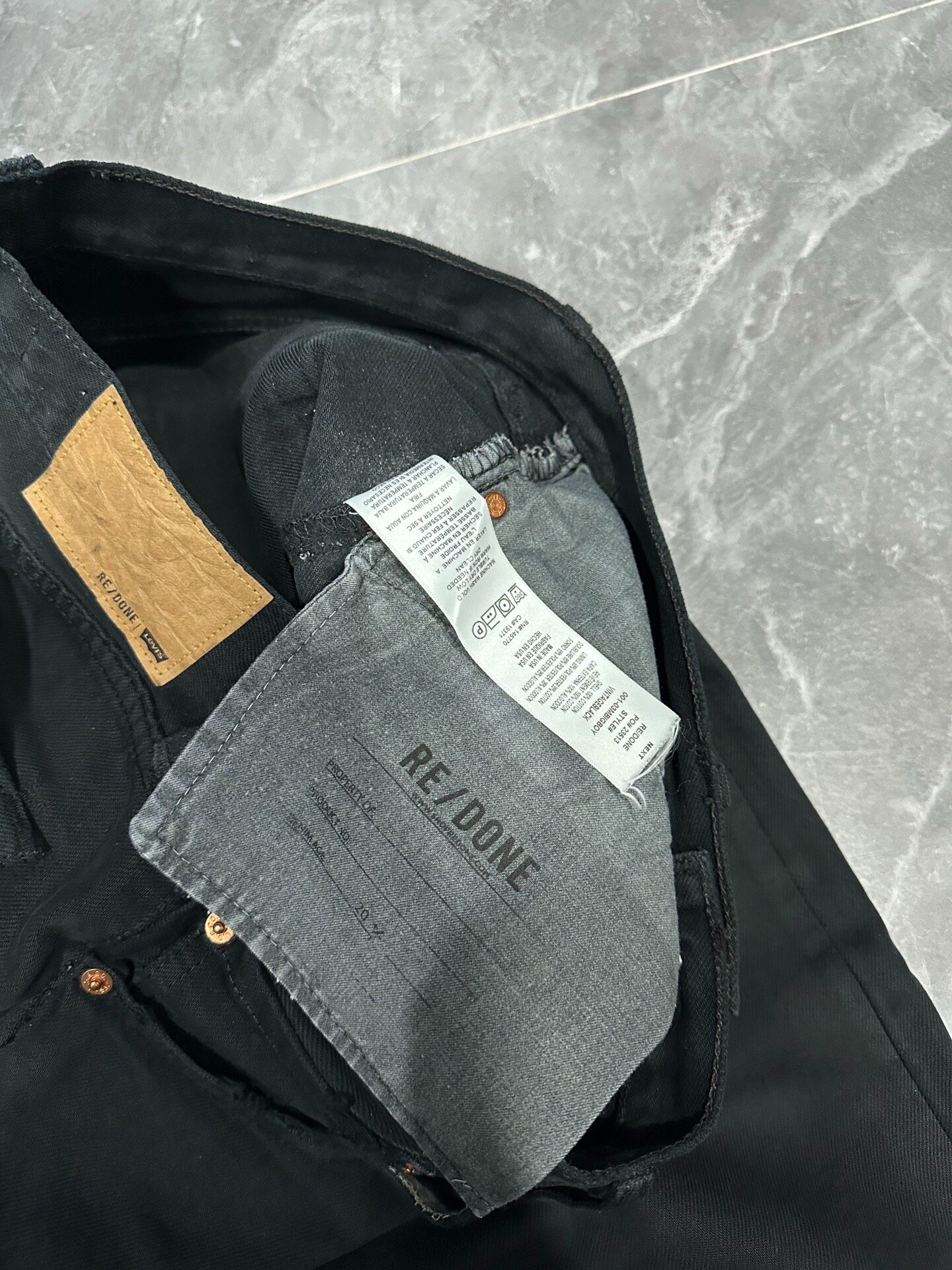RE/DONE Deconstructed Wide-Leg Jeans — label