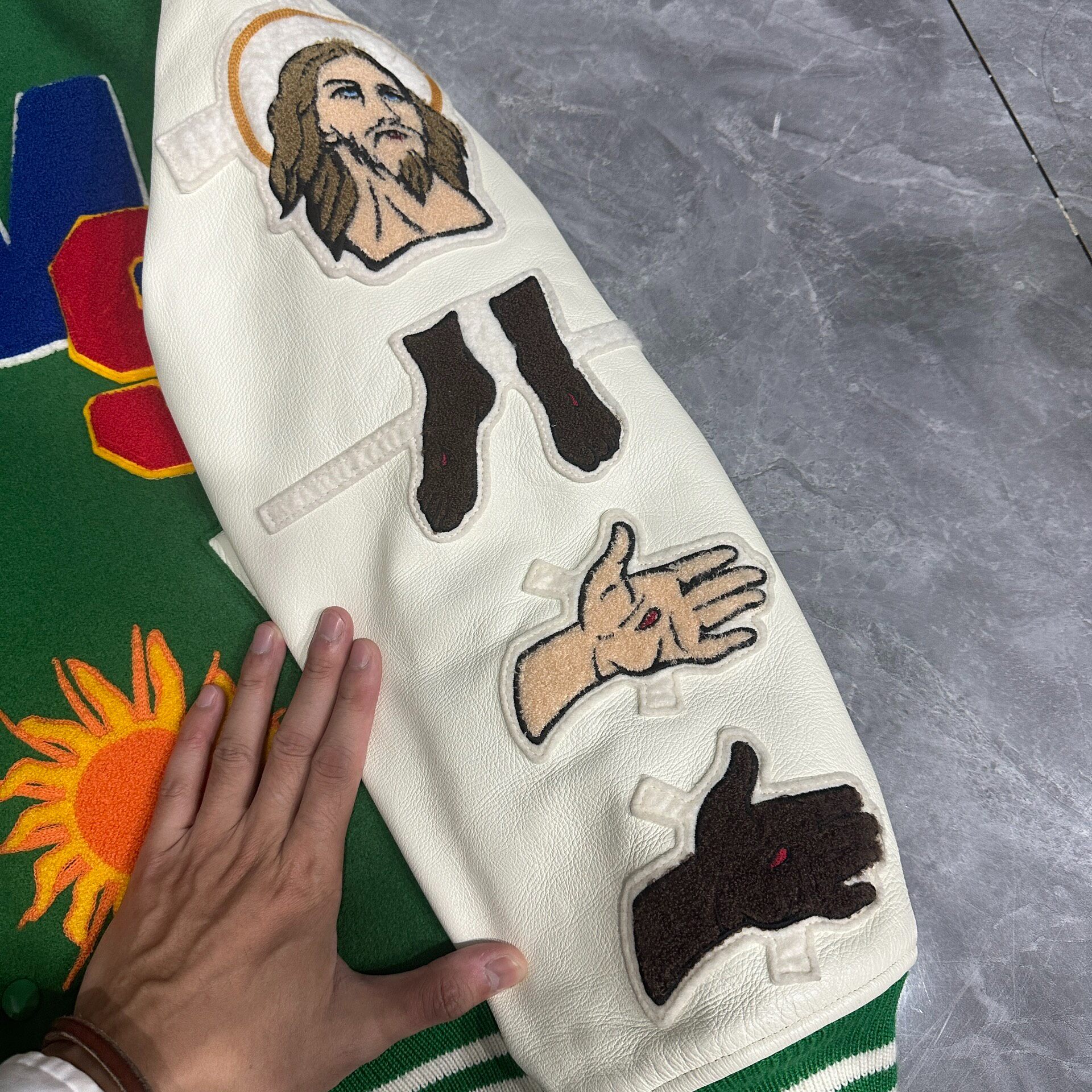 Saint Michael Graffiti Cross Varsity Jacket — detail