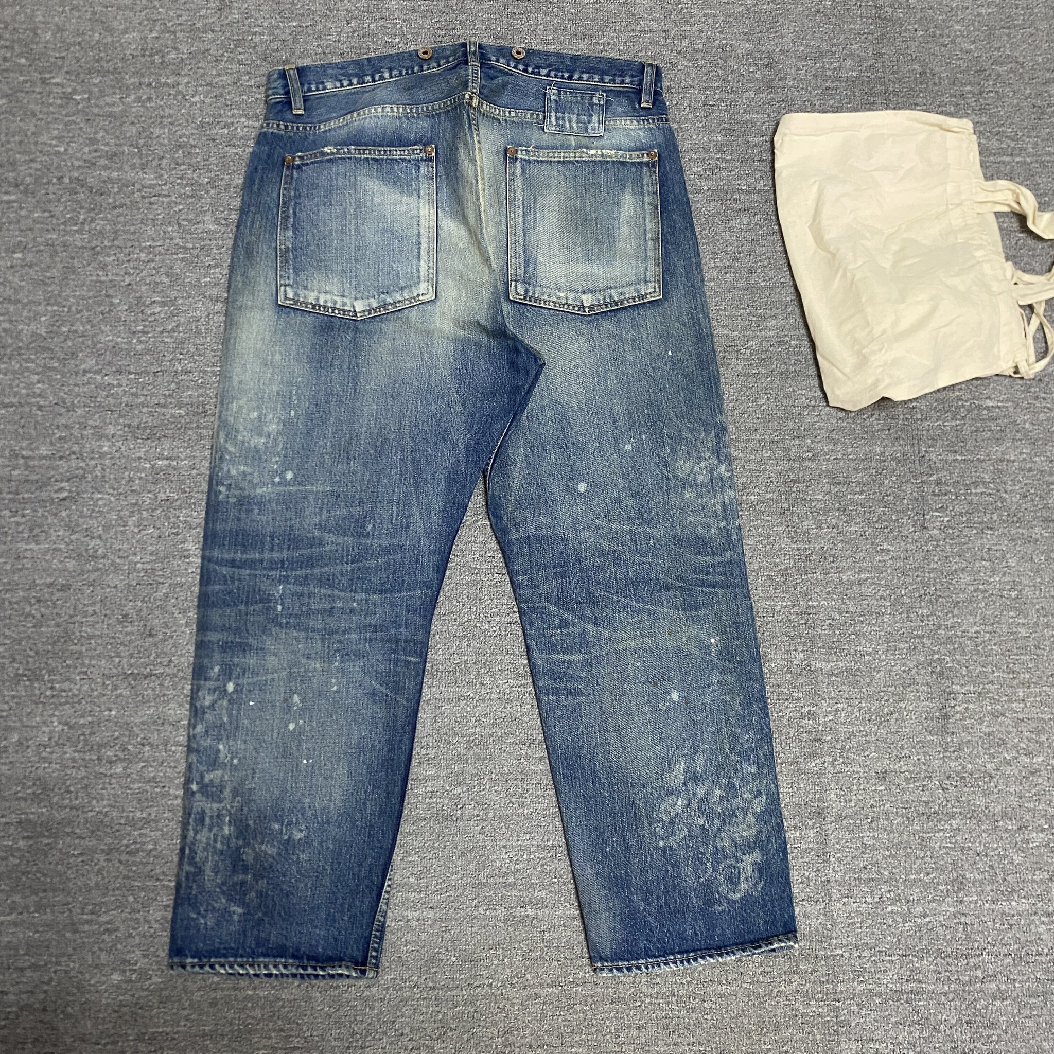 MADNESS 23AW Acid Wash Denim Jeans — front
