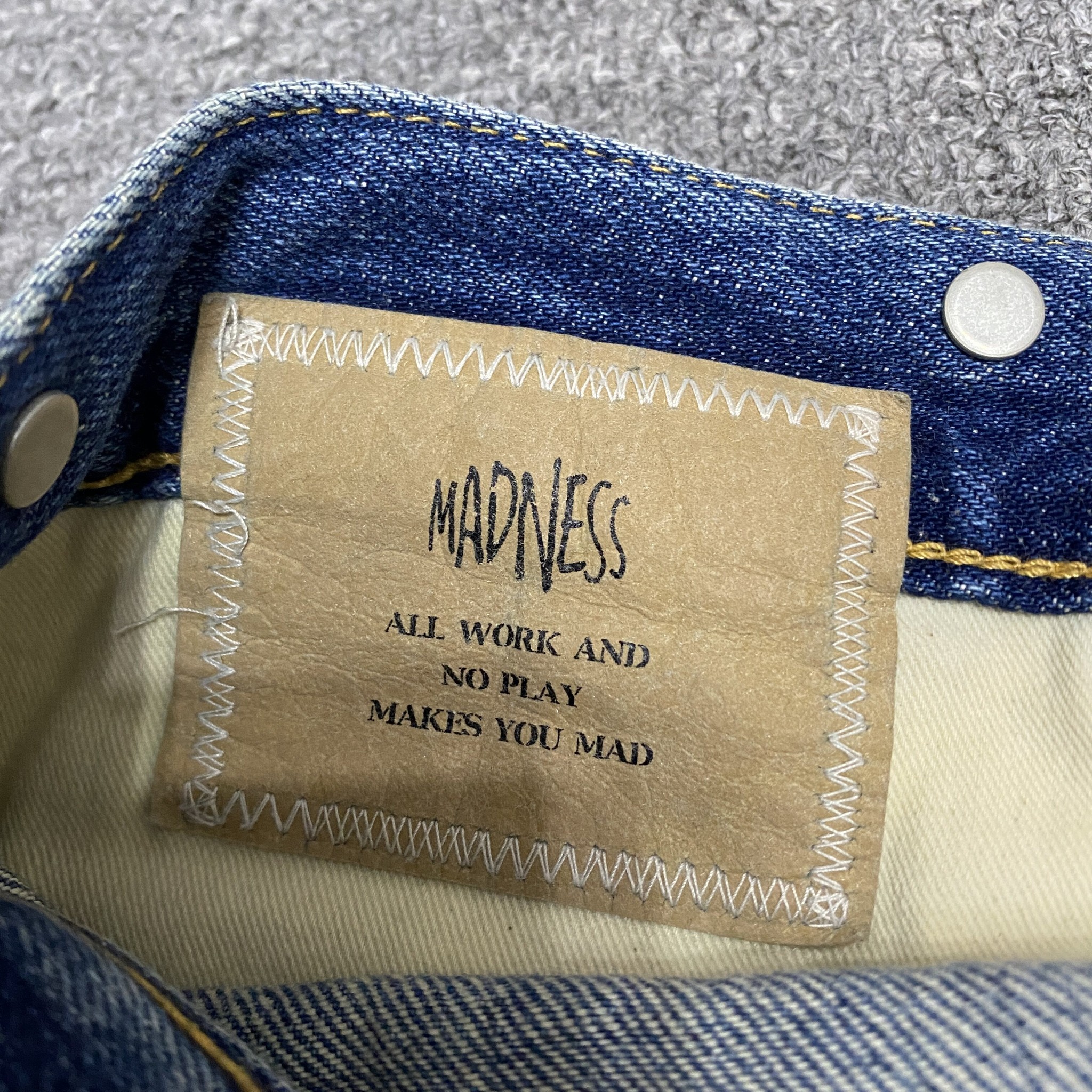 MADNESS 23AW Denim Jeans — label
