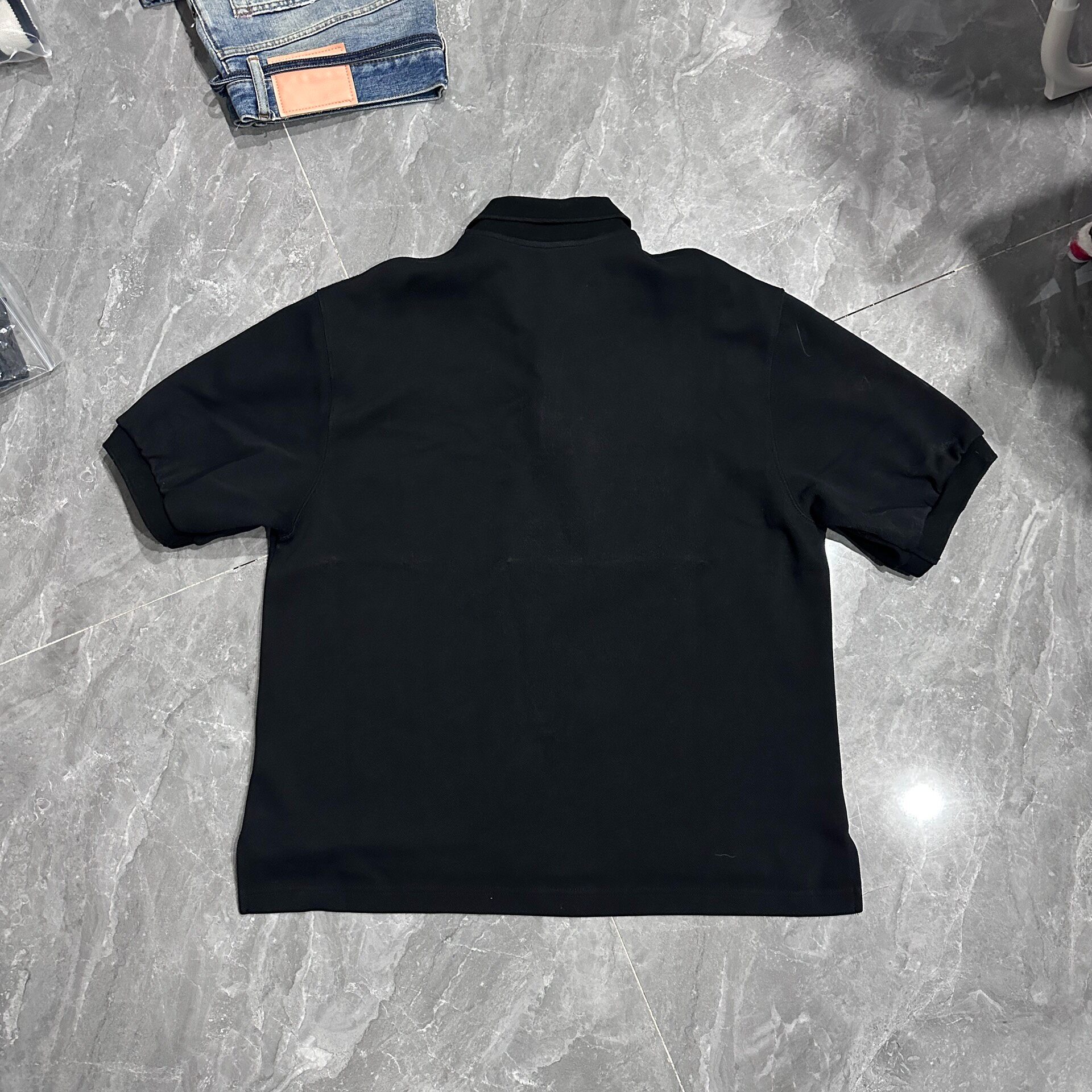 WE11DONE SS22 Unisex Logo Polo Shirt — front