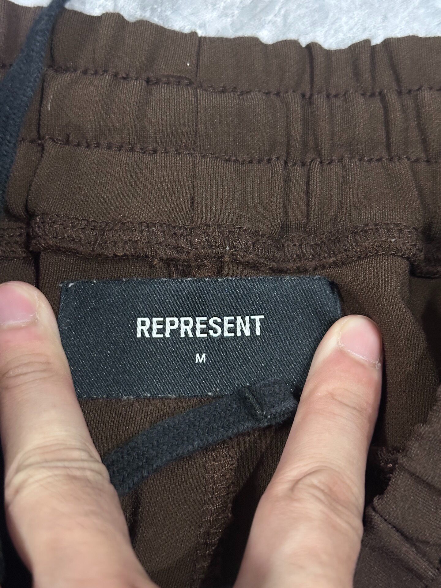 Brown Micro-Flared Suit Trousers — label