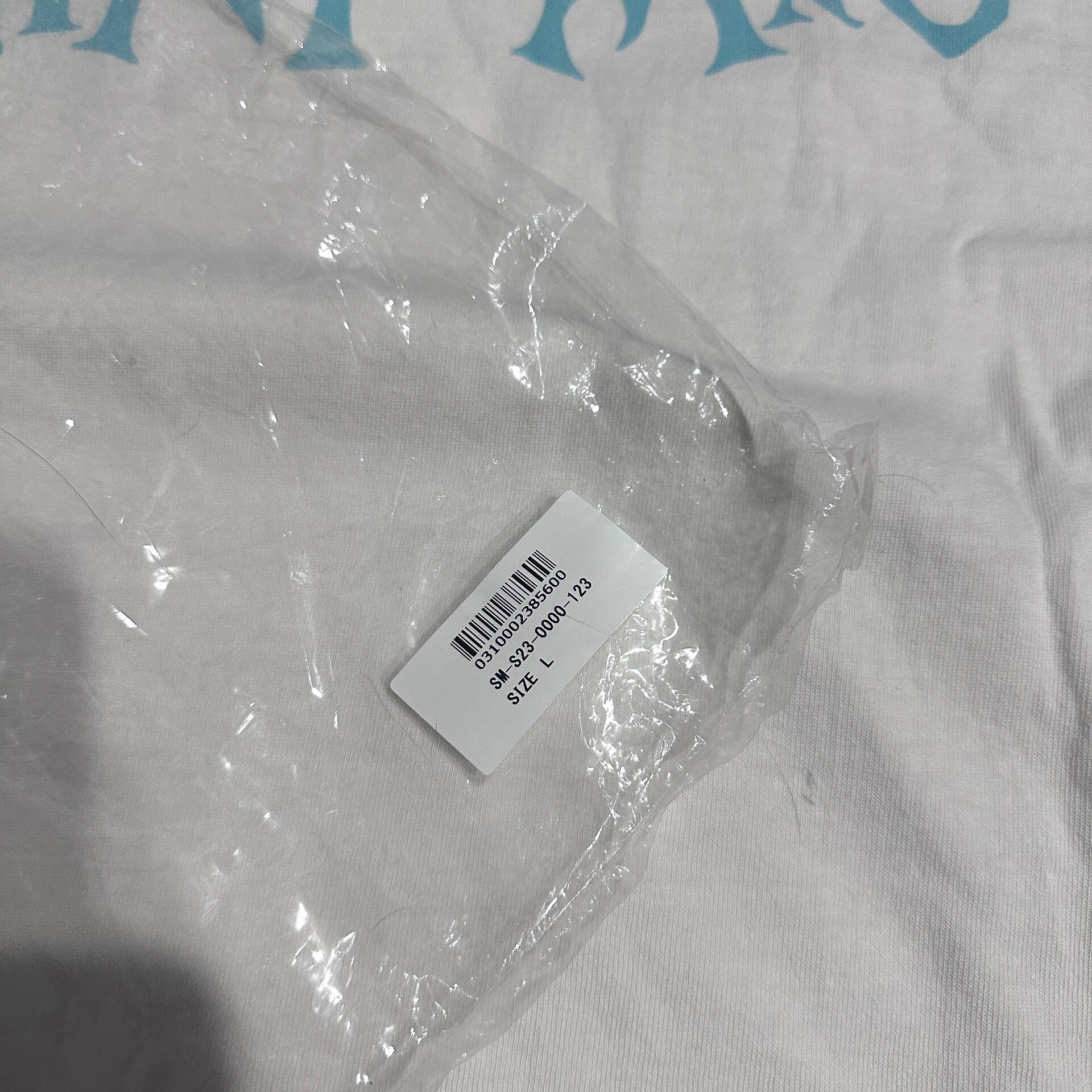 Saint Michael White Queen Graphic T-Shirt — label