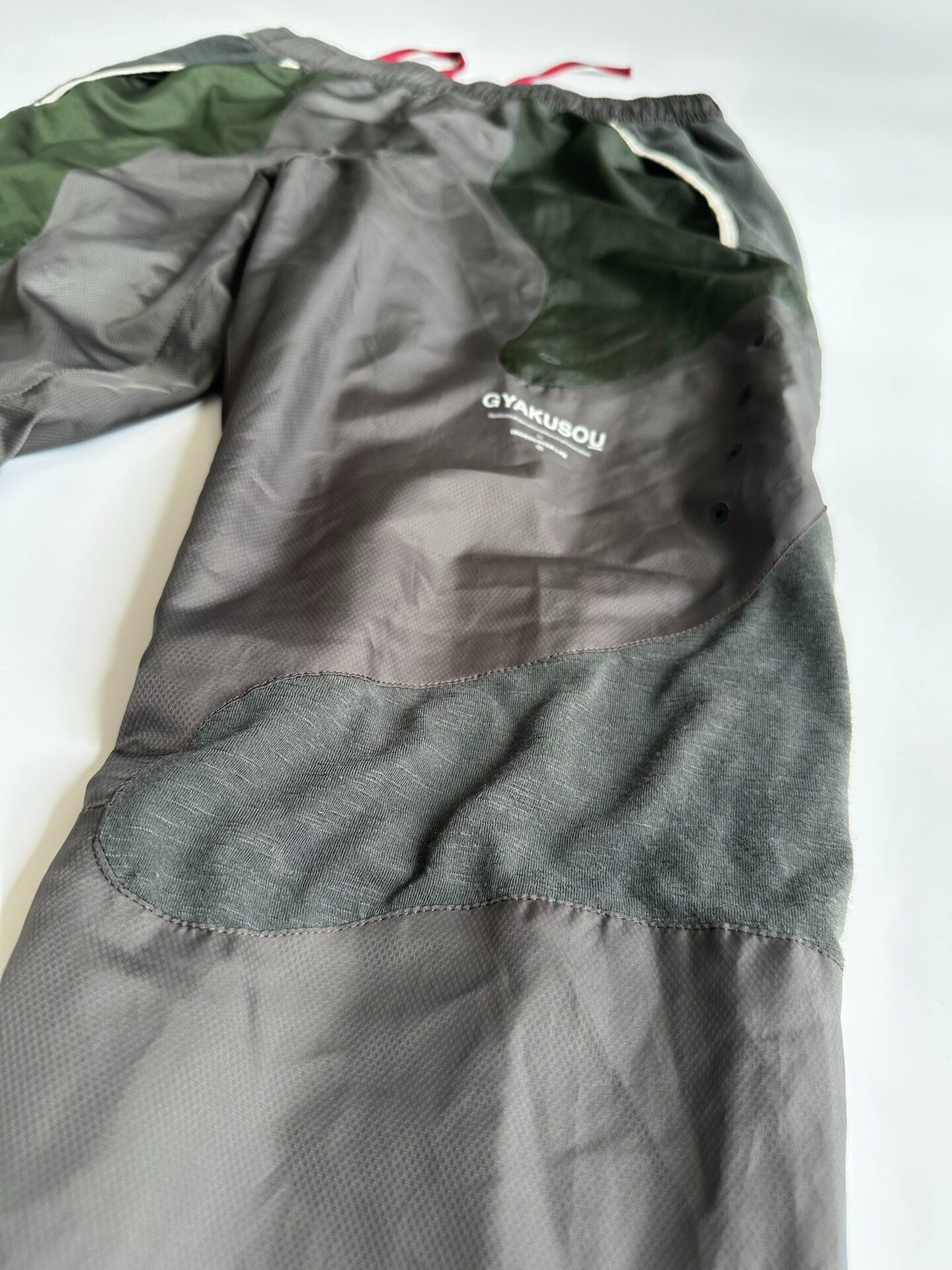 Undercover Gyakusou x Nike Track Pants — label