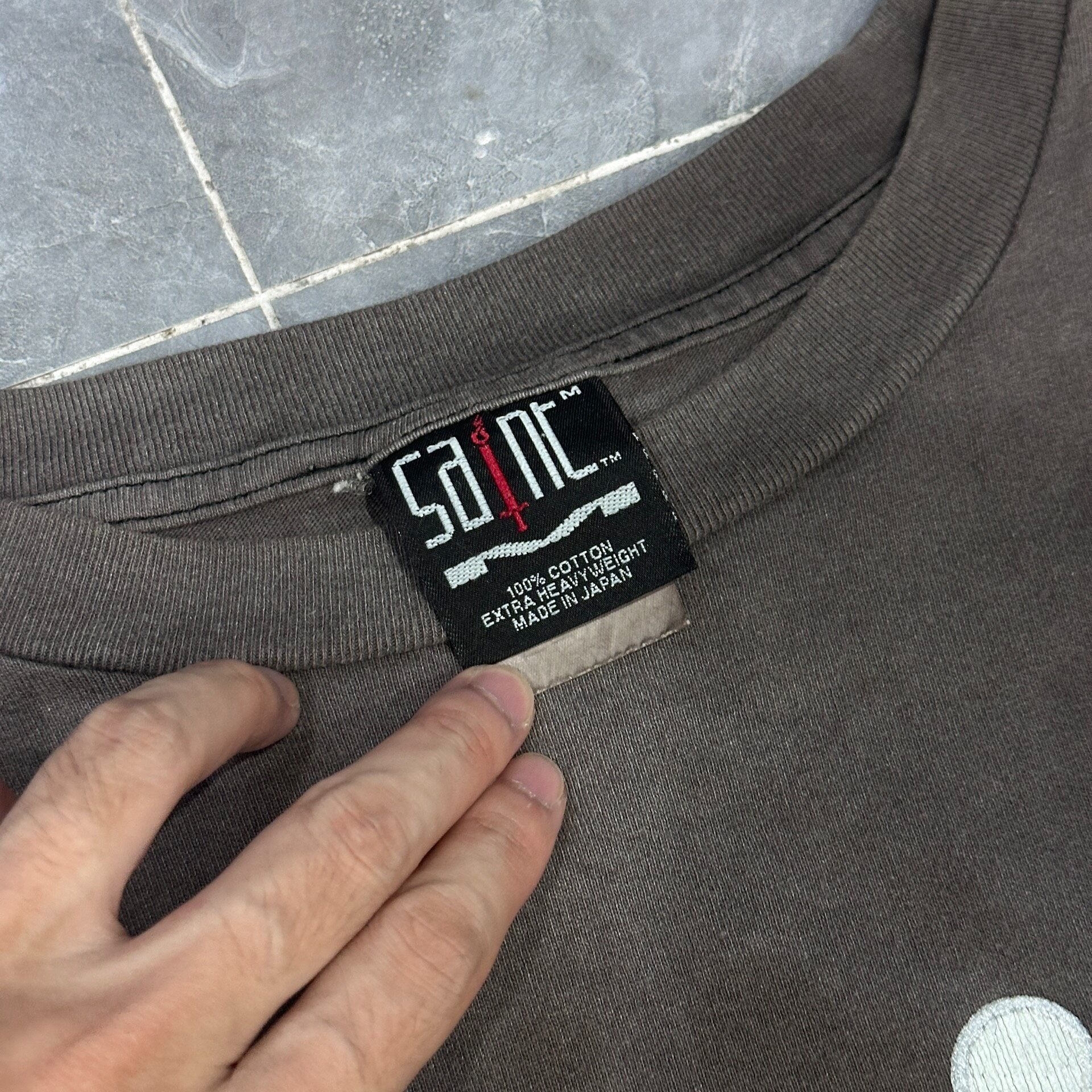Saint Michael Faded Target Script Tee — label