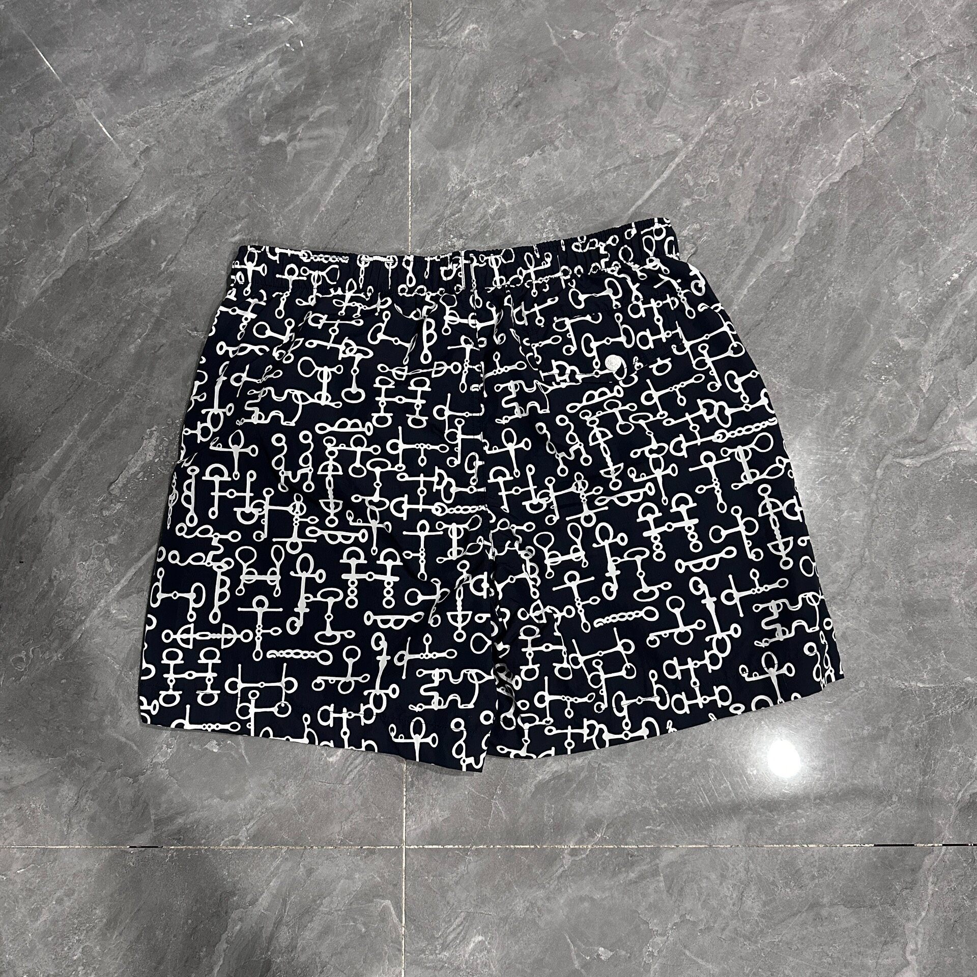 Hermes Lock Detail Black Beach Shorts — front